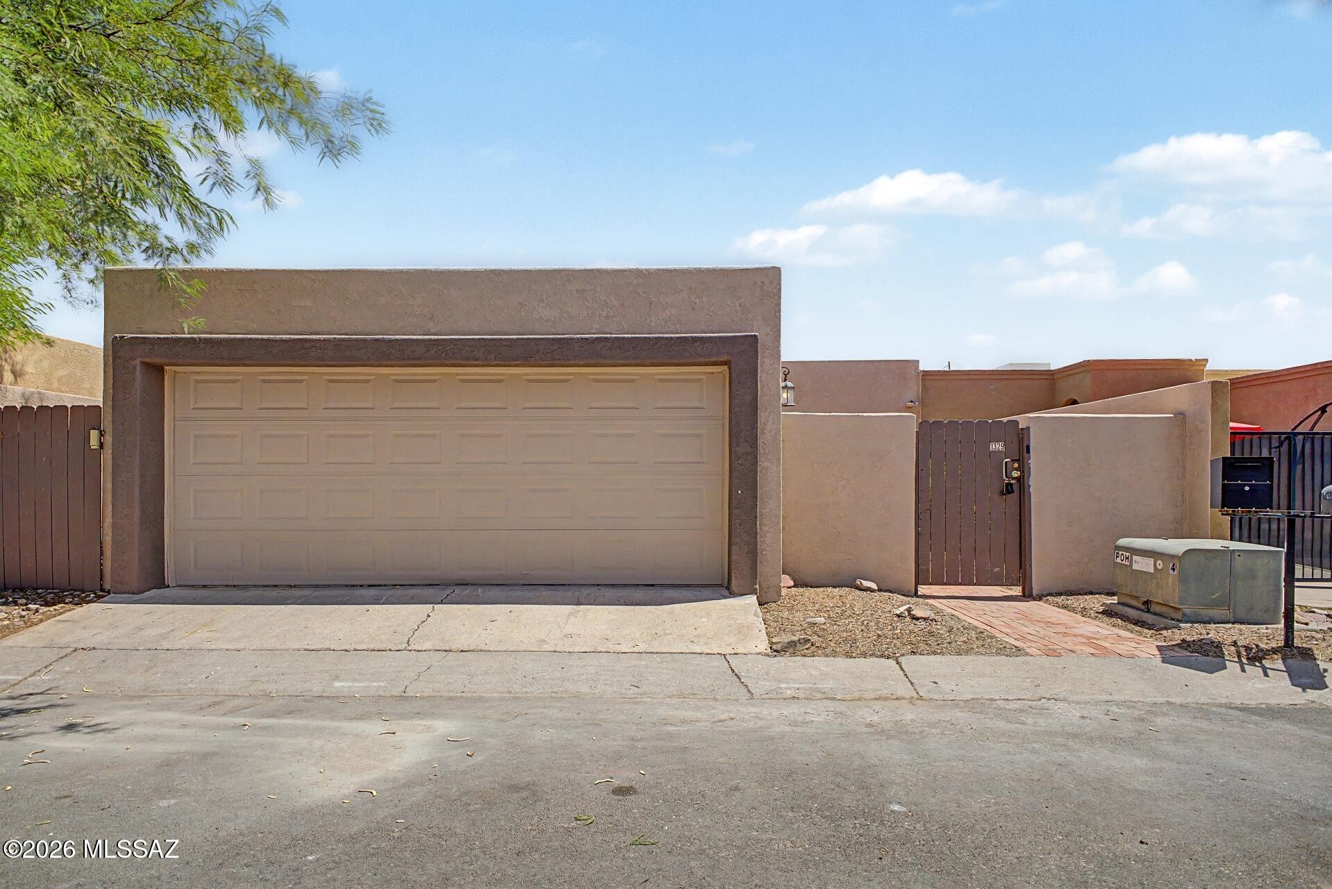Welcome to your dream home! This tastefully updated 2-bedroom gem is near Menlo Park in Tucson! From the moment you enter, you'll be amazed by the perfectly flowing living & dining room, beautifully centered around a cozy wood-burning fireplace. Fresh paint, ceiling fans, wood-look tile flooring, & bountiful natural light enrich the overall appeal. The kitchen offers stainless steel appliances, white cabinets, recessed lighting, & peninsula w/ breakfast bar. Impeccable primary bedroom serves as your private retreat, complete w/ sliding glass doors to the back patio, a six-panel door closet, and bathroom w/ shower & tub combo. Spacious backyard w/ a covered patio & sparkling pool creates the ideal setting for relaxing or entertaining guests. Hurry! A deal like this won't last! Agent/Owner