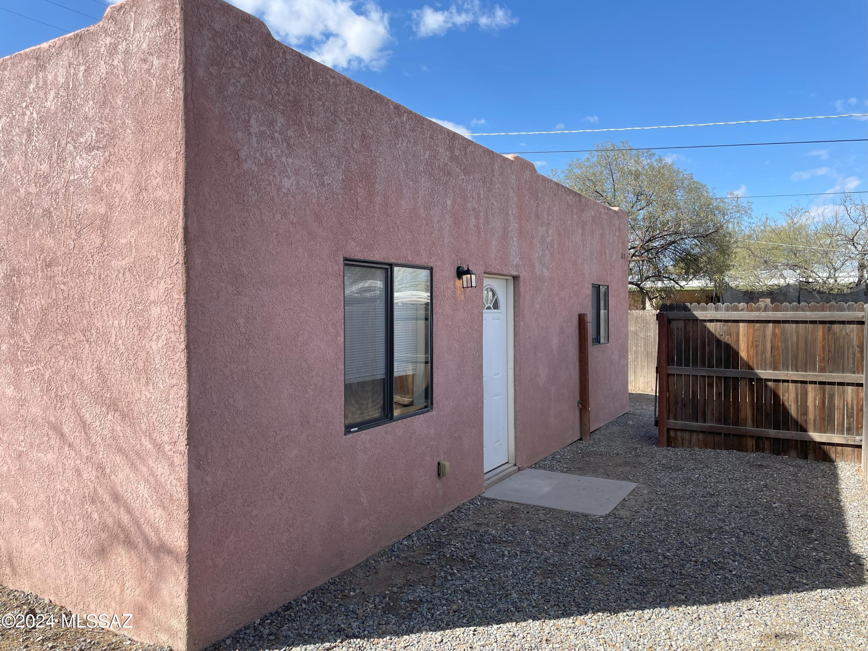 Newer construction! This 2 bedroom 2 bath includes stained concrete floors, open kitchen/greatroom plan including electric stove, microwave and refrigerator. The hall bathroom has a tub/shower combination, and the owners en-suite has a shower. Spacious bedrooms both include walk in closets and ceiling fans. Private yard area encircles the home. Close to Barista del Barrio with their award winning coffee and breakfast burritos, many other dining and shopping options nearby. Close to downtown and the U of A as well. Water and trash are included. Call for a viewing appointment today.