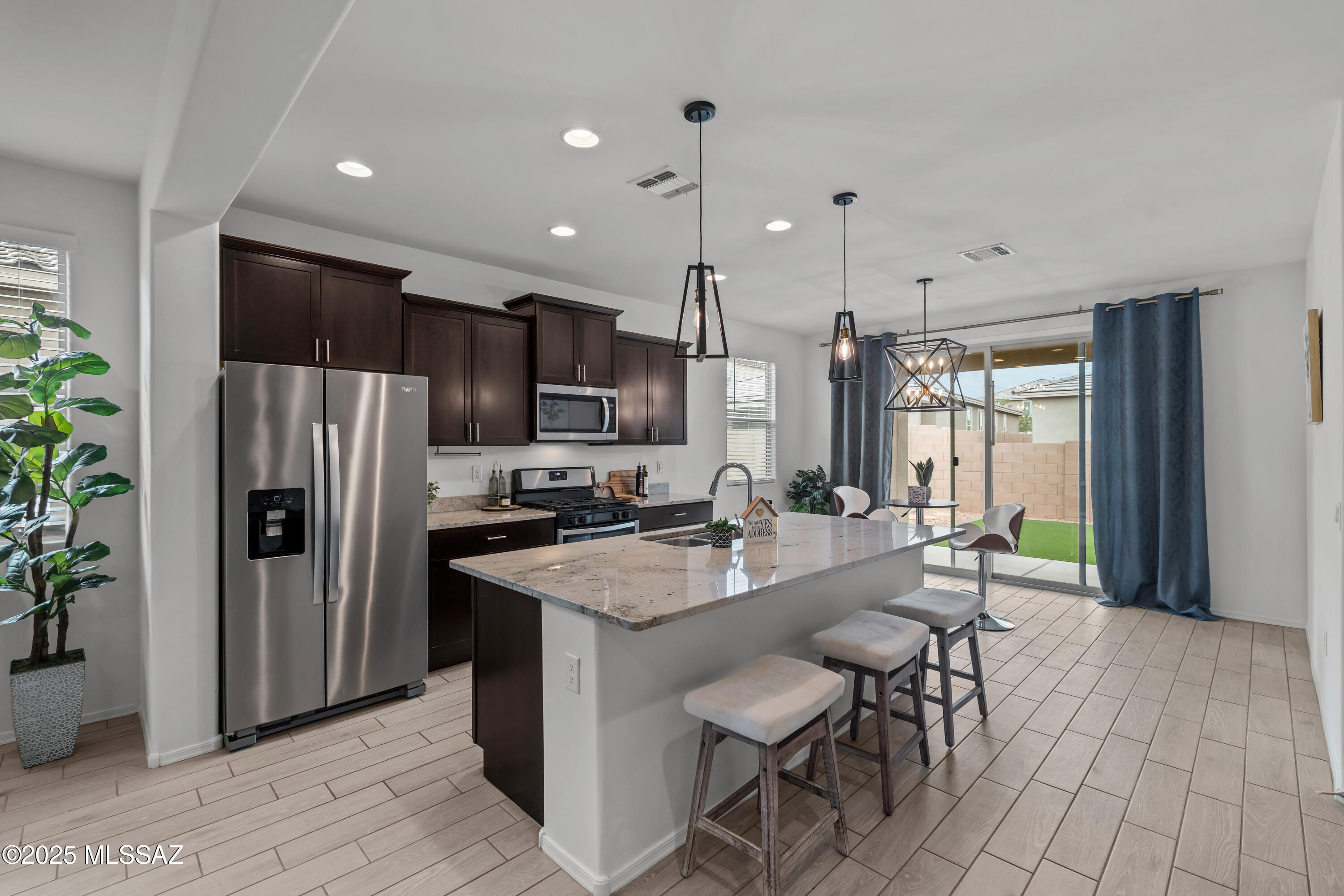 Ask about the assumable 2.75% VA loan! Qualified buyers--including eligible non-VA buyers--may be able to assume this incredibly low interest rate, offering significant savings compared to today's rates.

Built in 2021, this move-in-ready home already includes the upgrades buyers want without the added expense of landscaping, window treatments, and other post-construction costs.

Located in the highly sought-after Rancho Sahuarita community, this 4-bedroom, 2-bath home features beautiful wood-look tile throughout the main living areas, an open-concept floor plan, granite countertops, staggered espresso cabinetry, and stylish accent lighting.

Relax in the landscaped backyard, then enjoy everything Rancho Sahuarita has to offer, including a lake, multiple pools, clubhouse, fitness cen