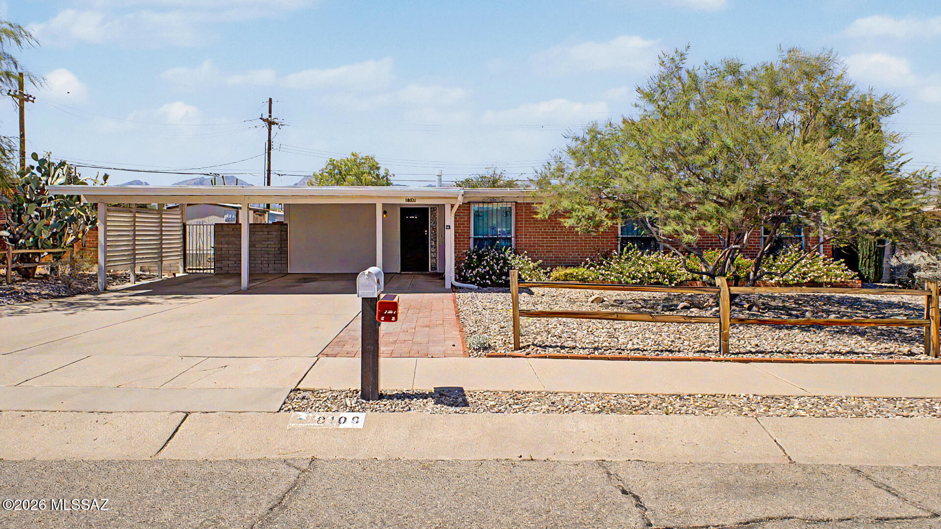 Welcome to 8109 E 3rd Street, a beautifully updated and move-in-ready home in the heart of Tucson. Inside, you'll find luxury vinyl plank flooring, fresh finishes, abundant natural light, and a spacious living area anchored by a stunning floor-to-ceiling stone fireplace with custom built-in shelving. The remodeled kitchen features white shaker cabinetry, modern countertops, stainless steel appliances, and ample storage. Skylights enhance the bright, open feel throughout the home. Outside, enjoy mature shade trees, low-maintenance desert landscaping, covered parking, and inviting outdoor living spaces. Conveniently located near shopping, dining, parks, and schools, this home offers the perfect blend of comfort, style, and everyday convenience.