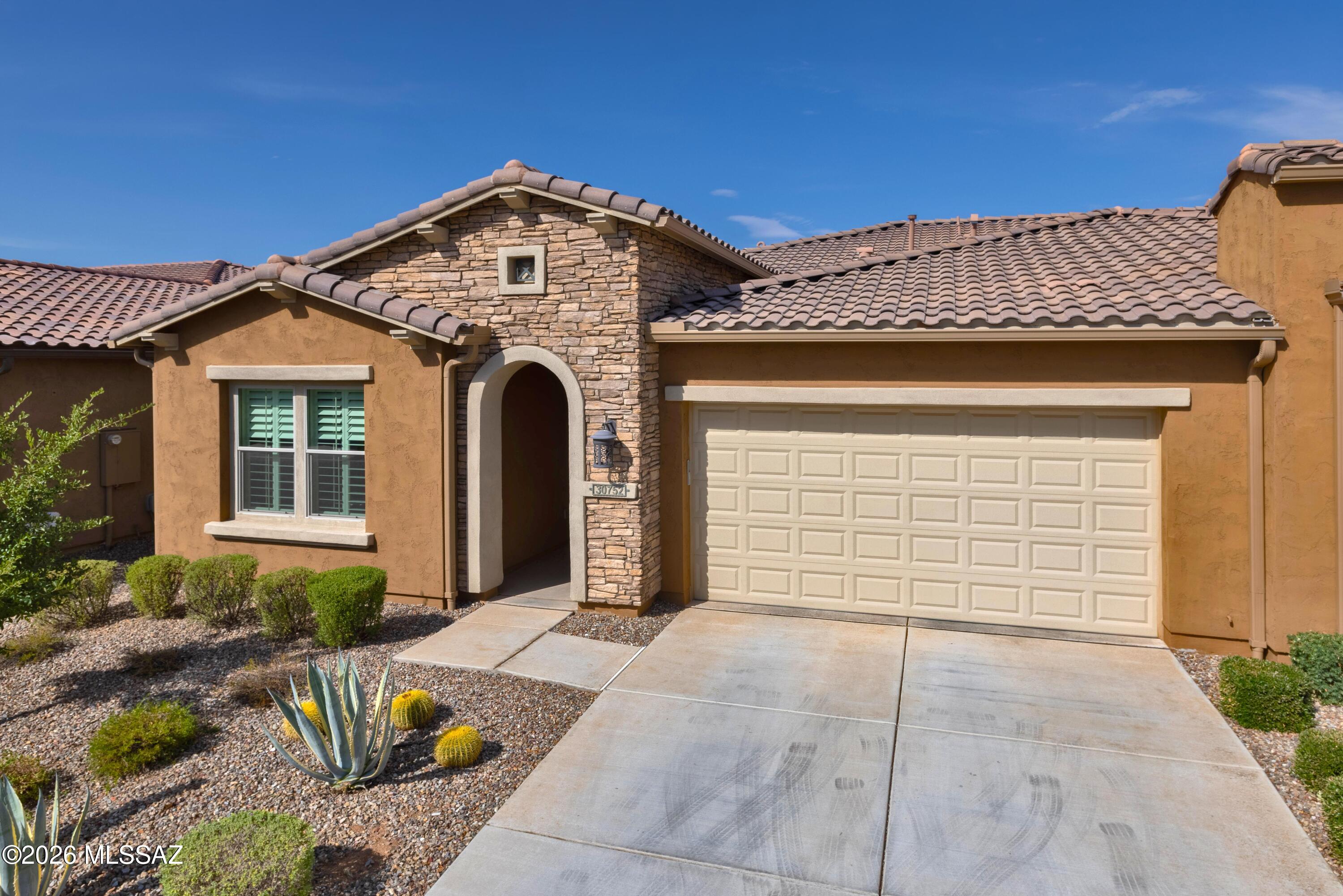 This is a beautiful 1707 Sq. Ft. Viva Villa Exterior Design __ built in 2020 that looks over a gorgeous Arroyo with a walking path.  This home includes 2-Bedroom En Suites, Great Room w/Media Alcove, Dining Area, Spacious Den, Grand Kitchen Island w/Walk-In Pantry, Optional Powder Room, Separate Laundry Room, 274 Sq. Ft. Covered Outdoor Living Space, Deel 2-Car Garage, 9' & 10' Ceilings, and a 214 Sq. Ft. Enclosed Private Courtyard with gate.  The buyer has the incredible option of buying this unit and the attached unit as both are owner by the same individual = truly an investor's dream!