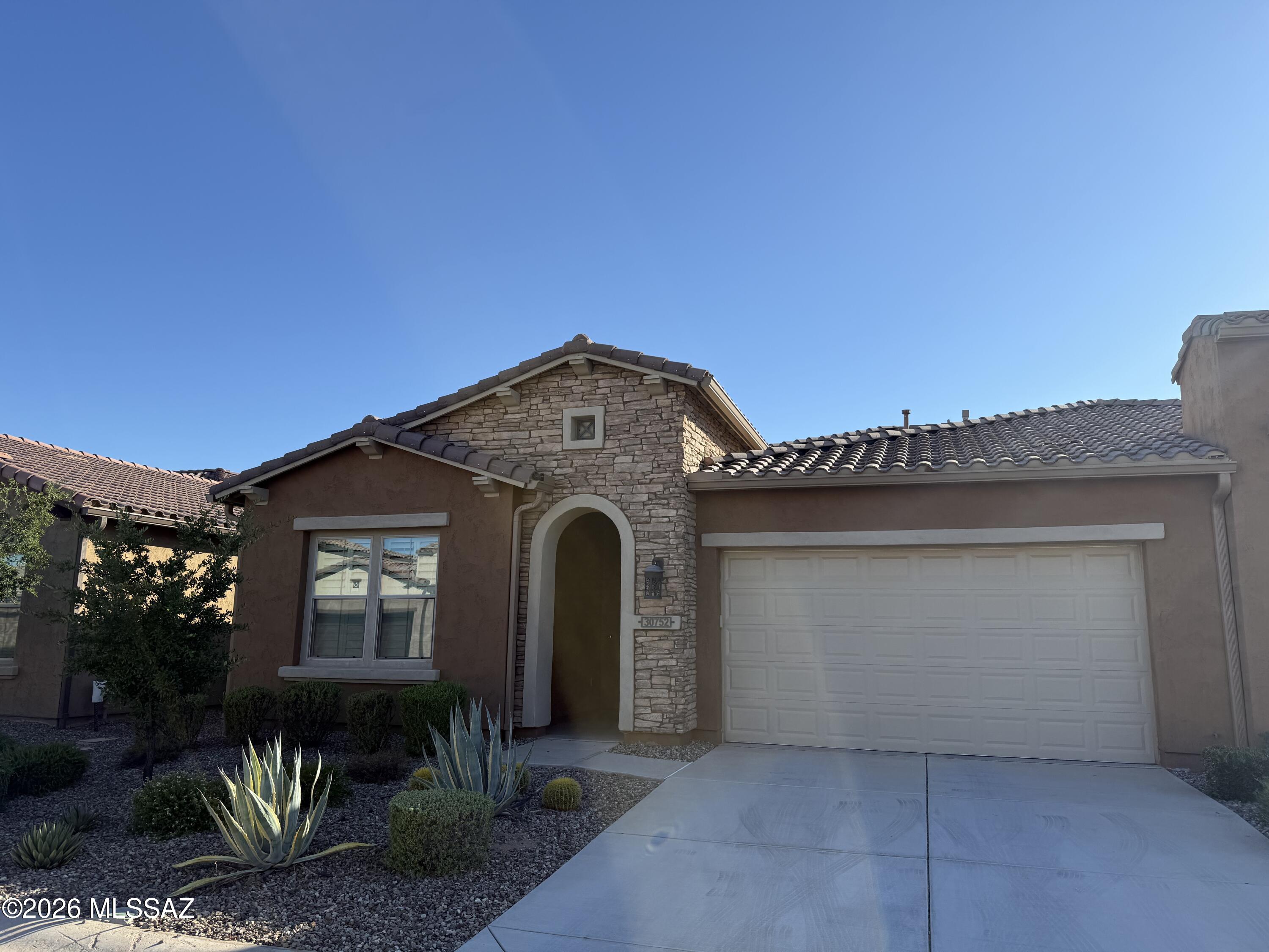 This is a beautiful 1707 Sq. Ft. Viva Villa Exterior Design __ built in 2020 that looks over a gorgeous Arroyo with a walking path.  This home includes 2-Bedroom En Suites, Great Room w/Media Alcove, Dining Area, Spacious Den, Grand Kitchen Island w/Walk-In Pantry, Optional Powder Room, Separate Laundry Room, 274 Sq. Ft. Covered Outdoor Living Space, Deel 2-Car Garage, 9' & 10' Ceilings, and a 214 Sq. Ft. Enclosed Private Courtyard with gate.  The buyer has the incredible option of buying this unit and the attached unit as both are owner by the same individual = truly an investor's dream!
