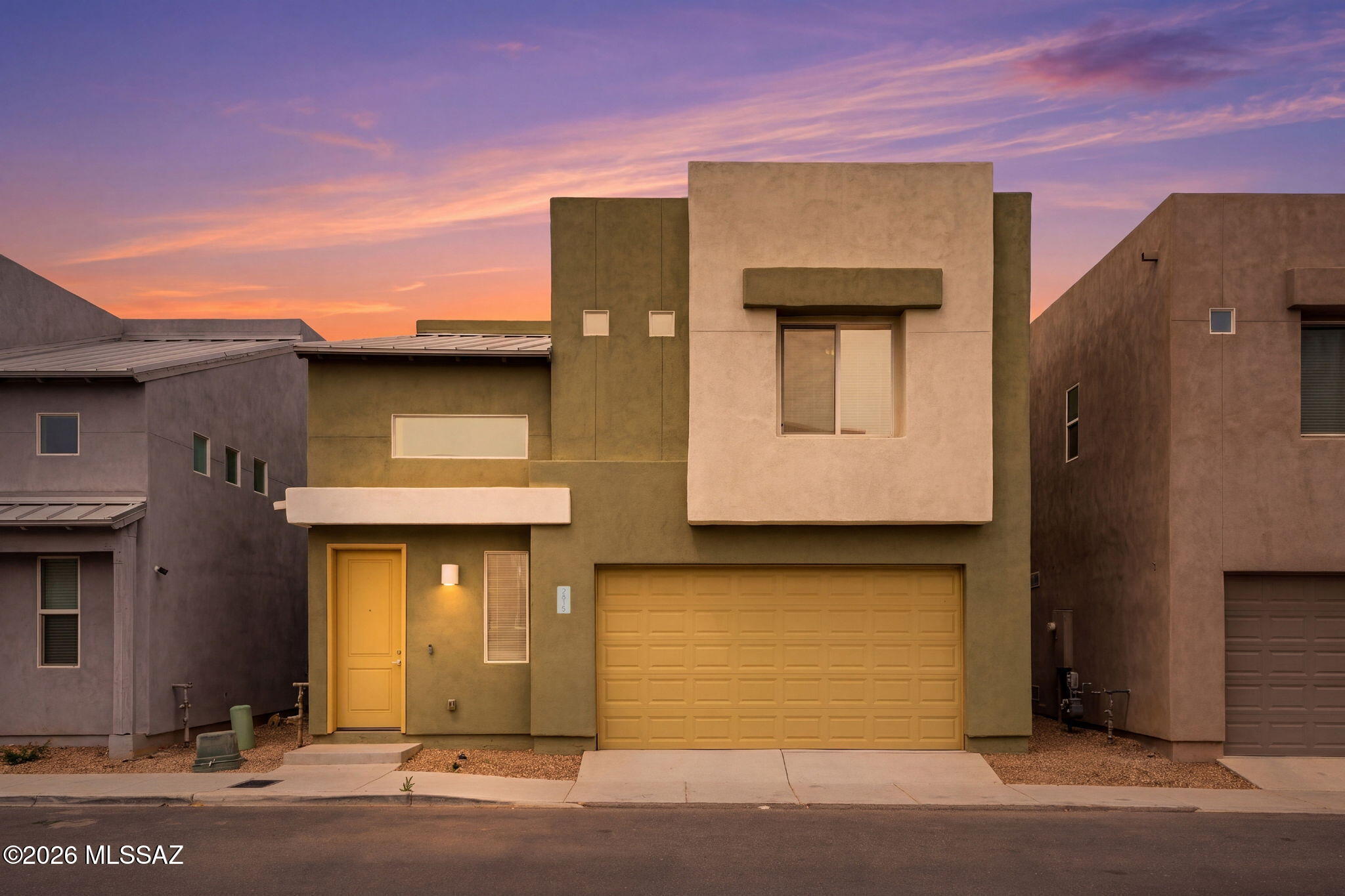 Amazing opportunity for turnkey 3 bed/2.5 bathrooms 1,631 SqFt, energy efficient 2019 built modern home with attached 424 SqFt finished 2 car garage on low maintenance lot located in thriving Central Tucson. Original owners, pride of ownership shines and priced well below the $360,920 RVM property value report! Featuring freshly painted outside, metal and built-up reflective roof, E/W orientation provide amazing sunsets, sewer clean outs, concrete driveway, on and off-street parking and concrete sidewalks. Inside buyers will appreciate Energy Star qualified energy efficient
double pane windows and slider throughout, soaring cathedral painted textured ceilings (no popcorn), custom window blinds and curtains, new gas Trane $12K HVAC 2025 w/transferable warranty, Ring security camera door bell, smart enabled digital thermostat, recessed lighting, LED lighting, 18" tile and plush carpet in bedrooms, downstairs bathroom, crisp white internal doors, illuminated ceiling fans, internal laundry room with matching Maytag washer & dryer included. 
Entertainer's dream open concept kitchen with gleaming full slab granite countertops, modern kitchen cabinets, gas stove, stainless steel appliance package, walk-in pantry closet, built-in microwave, dishwasher, large undermount sink, garbage disposal, garden window, dining area adjacent to spacious great room with abundant natural light and energy efficient slider leading to covered patio and low care backyard surrounded by concrete block privacy walls. Generous carpeted bedrooms, full guest bathroom w/executive height modern vanity, exhaust fan, shower and tub. Spacious primary suite with ensuite full bathroom, matching executive height modern vanity, walk-in tiled shower and sizable walk-in closet. 
Affordable $60 monthly HOA allows rentals and off-street parking. Fantastic Central Tucson location walking distance to 14.2 acre McCormick Park, an expansive neighborhood park featuring large green grassy fields, a basketball court, a playground, and baseball fields, Chuck Huckelberry Loop/Rillito River Path (136 mile multi-use connected paved path used for walking, running, biking and skating), close proximity to groceries, restaurants, shopping, Tucson Medical Center, minutes away from JCC, Banner Medical and the University of Arizona campus! Call to make your appointment to view this move-in ready modern home today!