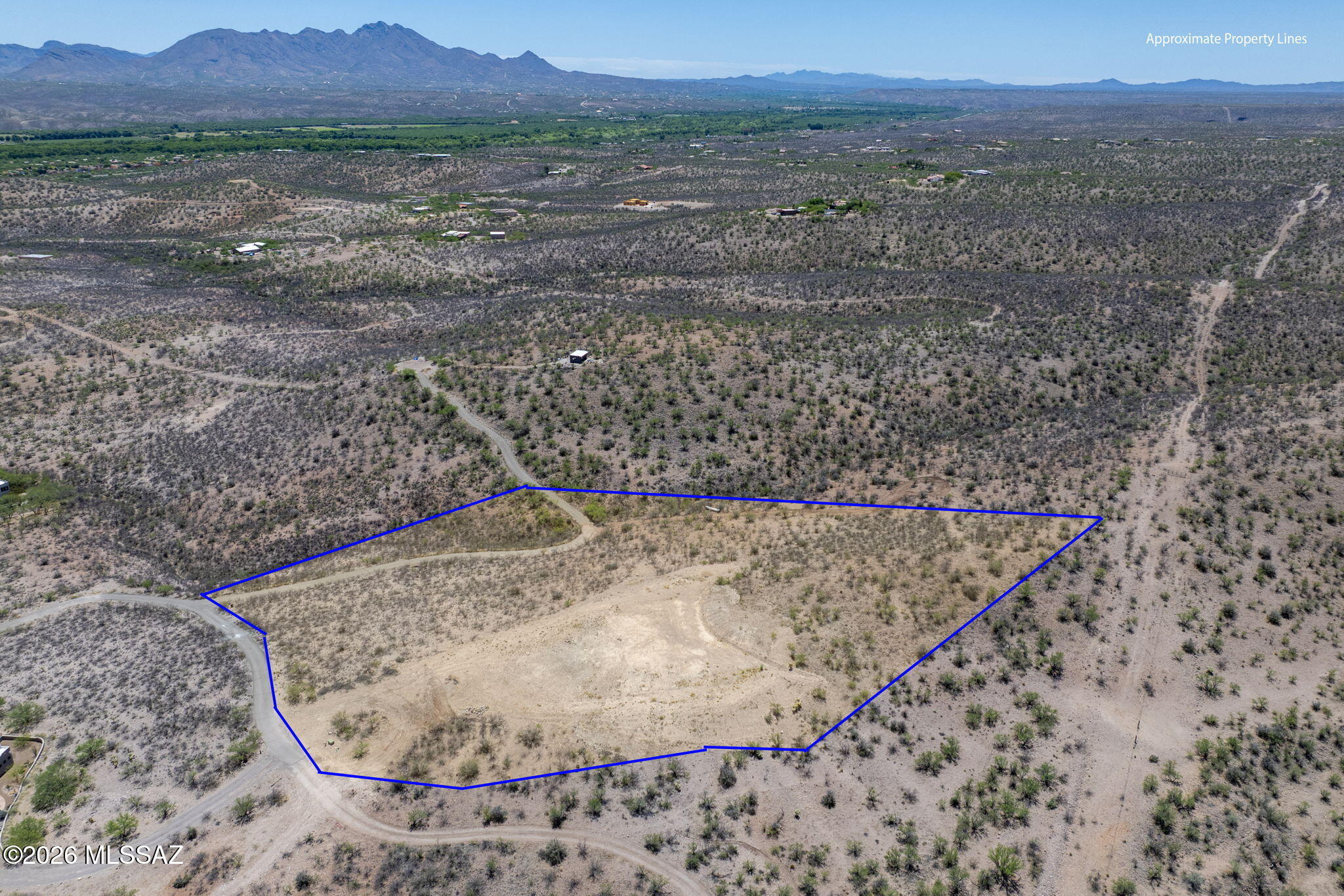 Enjoy the best of both worlds with this beautiful 4+ acre parcel offering the charm and privacy of country living while still enjoying the conveniences of a neighborhood setting. Take in sweeping views of the Tumacácori and Santa Rita Mountains along with the stunning Santa Cruz River Valley. The property features a shared well and storage tank already in place, plus phone and electric available to the lot -- making it ready for your dream home. A homesite pad has already been cleared, giving you a head start on building. Located just a short drive from Tubac, you'll have easy access to shopping, dining, golfing, hiking, and all the unique charm the area has to offer. The owner has a set of building plans available for the property!