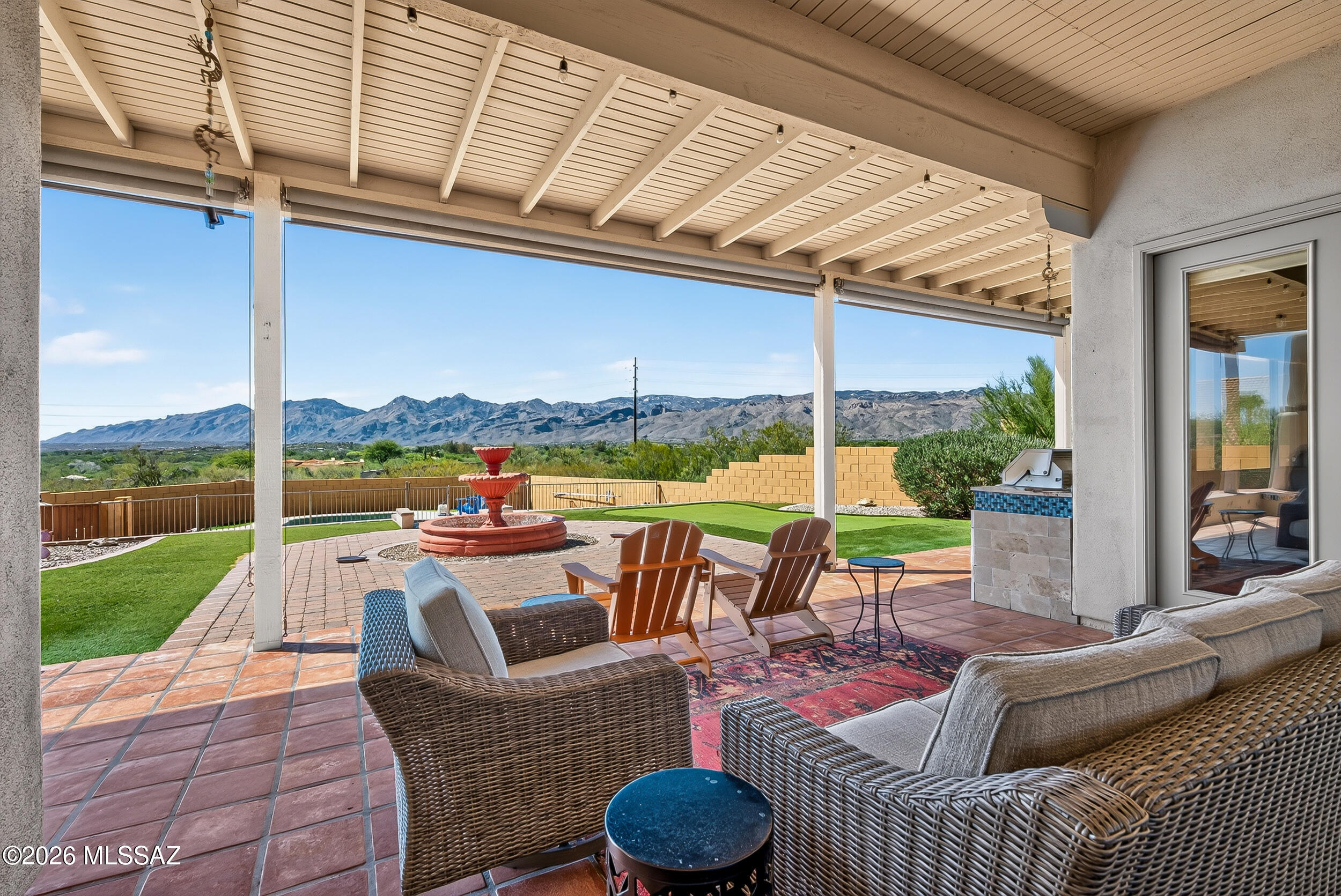 Seller will accept or counter offers between $700,000 and $725,000. Nestled on an acre in the gated Arizona Estates community. This beautifully maintained custom home offers the perfect blend of privacy, comfort, & desert beauty. Featuring 3 bedrooms, 2 baths, spacious den, & an open great room floor plan designed for both everyday living and entertaining. Enjoy high ceilings, abundant natural light, beautiful finished concrete floors, a remodeled primary bath, and a spacious kitchen with stainless steel appliances and ample storage. Step outside to your private north facing backyard retreat complete with a sparkling pool, spa, built-in BBQ, fireplace, putting green, & unobstructed Catalina Mountain views. A 2-car garage and a prime east Tucson location complete this exceptional property.
