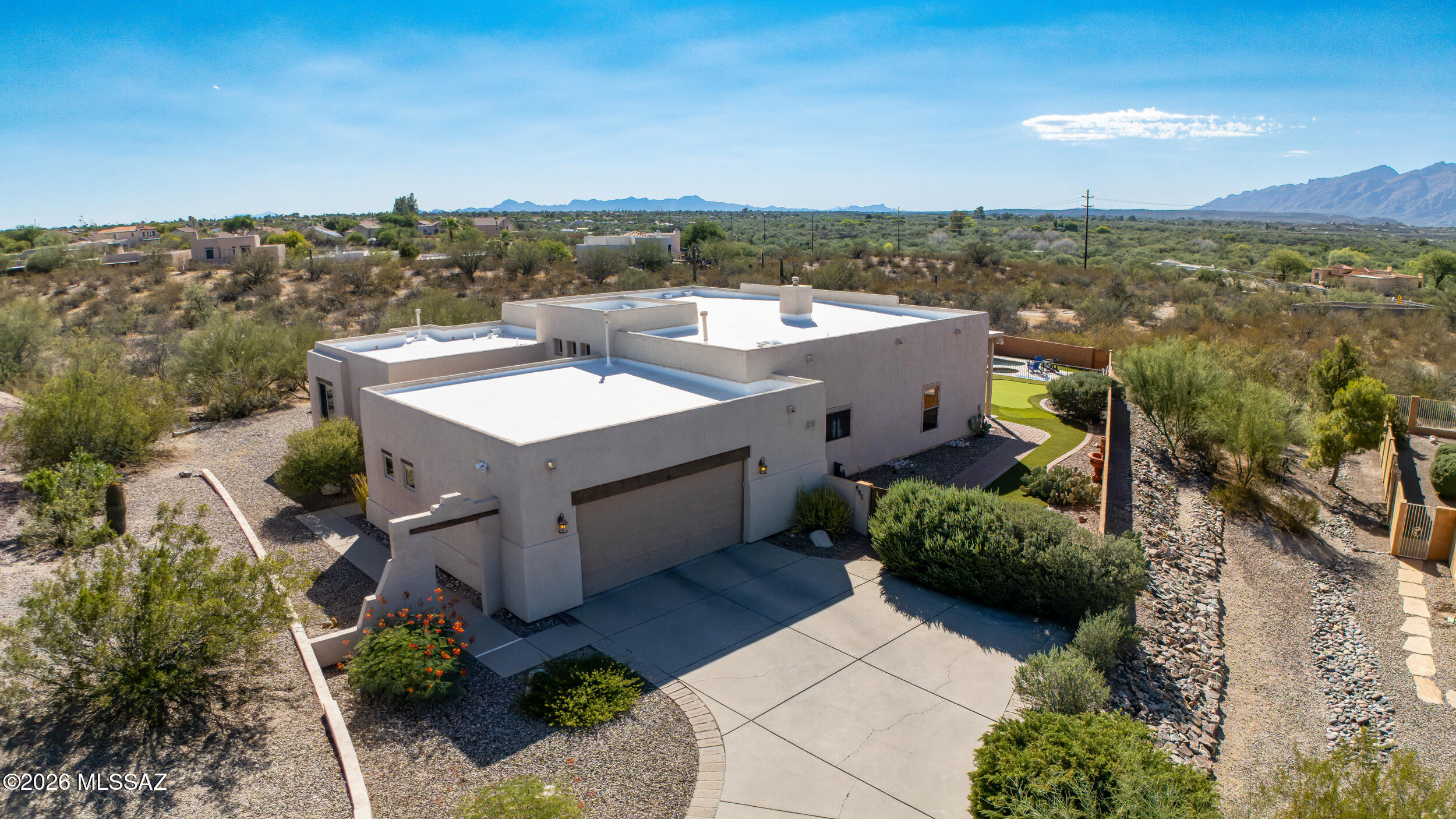 Seller will accept or counter offers between $700,000 and $725,000. Nestled on an acre in the gated Arizona Estates community. This beautifully maintained custom home offers the perfect blend of privacy, comfort, & desert beauty. Featuring 3 bedrooms, 2 baths, spacious den, & an open great room floor plan designed for both everyday living and entertaining. Enjoy high ceilings, abundant natural light, beautiful finished concrete floors, a remodeled primary bath, and a spacious kitchen with stainless steel appliances and ample storage. Step outside to your private north facing backyard retreat complete with a sparkling pool, spa, built-in BBQ, fireplace, putting green, & unobstructed Catalina Mountain views. A 2-car garage and a prime east Tucson location complete this exceptional property.