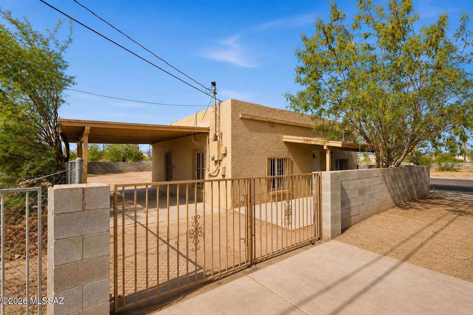 Fully remodeled 2 bed, 1 bath home on a rare half-acre corner lot with no HOA. This move-in ready 702 sq ft property features updated finishes throughout, a covered carport, and plenty of space for parking, storage, or future expansion. Huge added value with the oversized backyard offering potential space for an additional dwelling, guest house, workshop, or future investment opportunity. The corner lot layout provides flexibility that is hard to find at this price point. Ideal for investors, first-time buyers, or anyone looking for land and versatility in Tucson. Conveniently located near major roads, shopping, and dining. A rare combination of lot size, condition, and future potential.