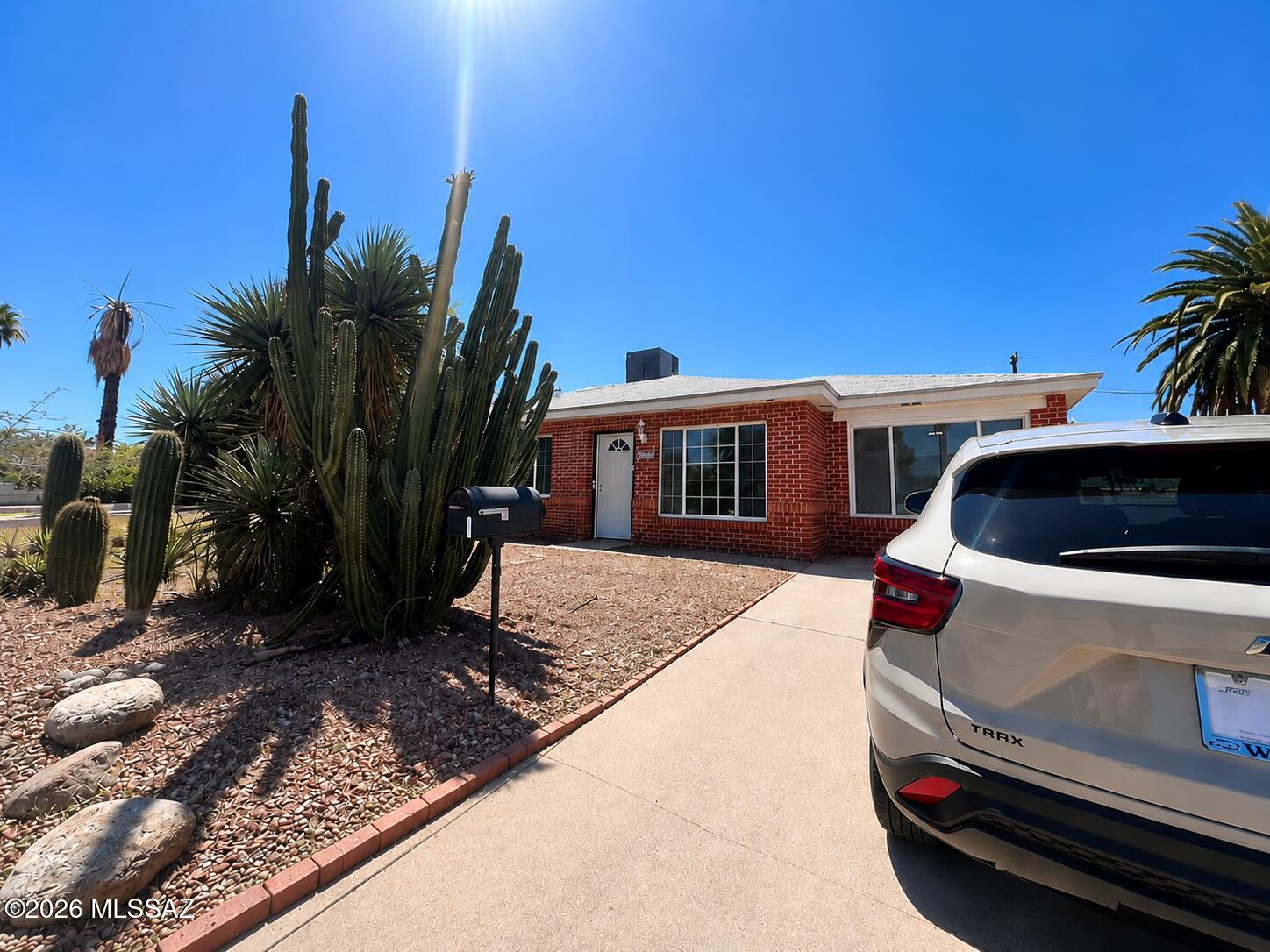 Beautifully maintained brick home with a spacious yard and detached garage/workshop! Features tile flooring, a flexible den office that can be used as a 4th bedroom, mature fruit trees, raised garden beds, and mountain views. Enjoy plenty of natural light, an open layout, and a spacious backyard. Includes refrigerator and stove and is move-in ready! Conveniently located near Park Place Mall, shopping, dining.