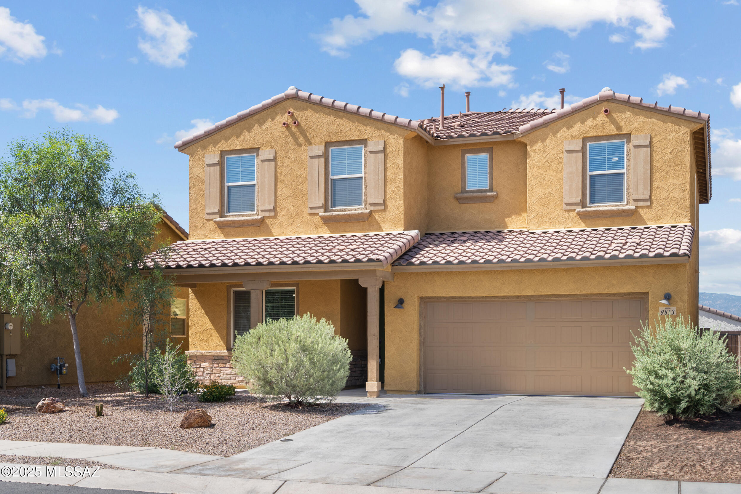 Welcome to Saguaro Trails!! This home has 4 bedrooms, a den/office, large loft, and a 3.5-car garage. The home also includes several upgrades such as wood plank tile downstairs, upgraded kitchen cabinets, granite countertops with a backsplash, and tile surrounds in both showers. The kitchen has a deep walk-in pantry with ample storage and a granite counter top drop station. Center meet sliding back doors lead to the extended covered patio with paver extension and built in fire pit surrounded by turf for outdoor entertaining. Enjoy a 7-acre amenity park with a resort-style pool, splash pad, playgrounds, and dog park, Saguaro Trails community received Community of the Year for the 2022 SABA . Located in the VAIL SHCOOL DISTRICT.