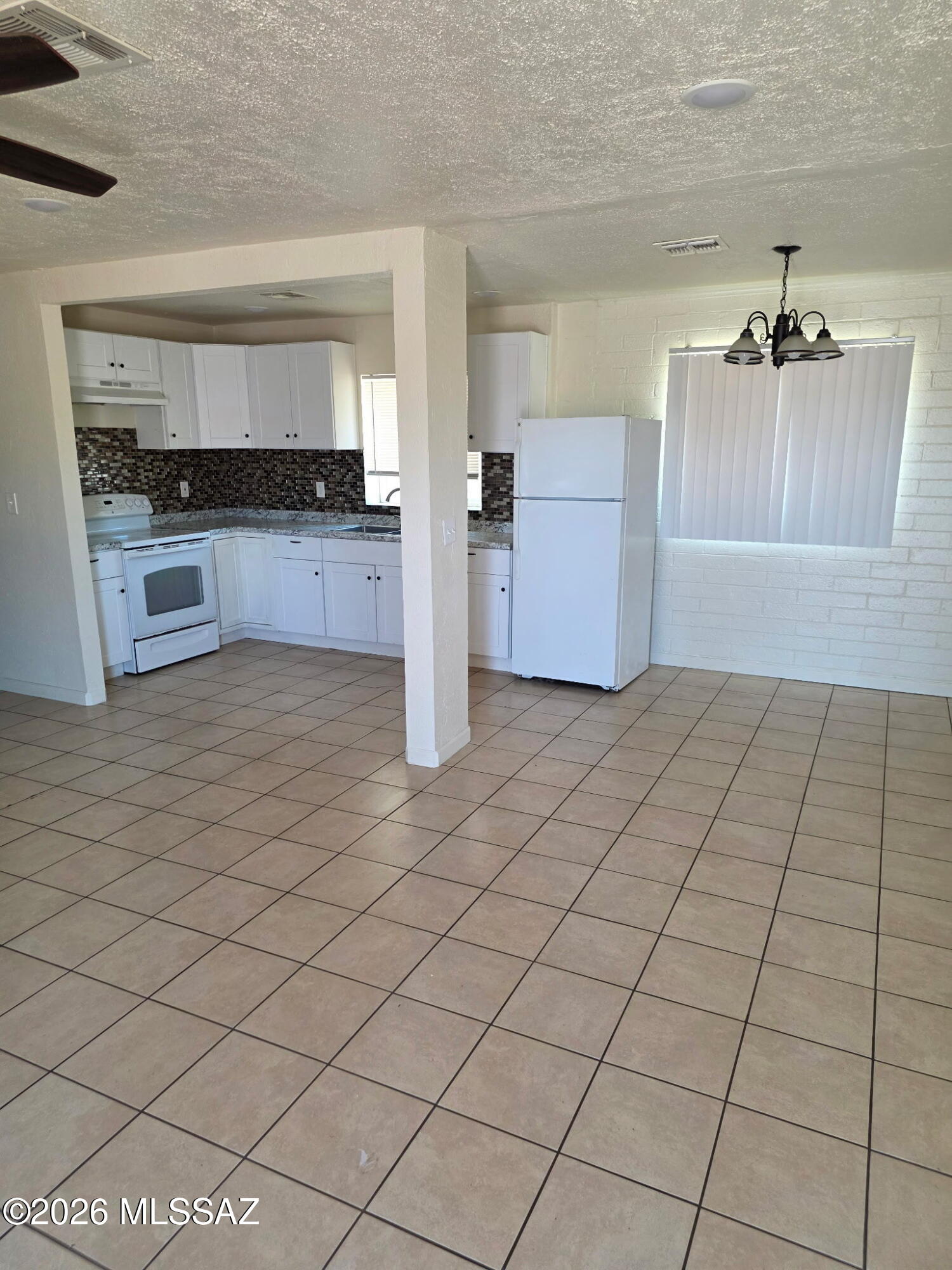 Wonderfully Remodeled & Move-In Ready!

This beautifully updated home features warm tile flooring, neutral paint tones, and modern recessed lighting throughout, creating a bright and inviting space ready for you to make your own. Stay comfortable year-round with a newer roof and air conditioning system that help keep the home cool during Tucson's hot summer months.

The fully functional kitchen offers ample space for daily living and entertaining, while the included washer and dryer add extra convenience. Enjoy the peace and quiet of this charming home, ideally located just minutes from shopping, dining, gyms, movie theaters, golf courses, and the University of Arizona.

A lovely, comfortable home in a convenient location--don't miss this opportunity! 🏡✨