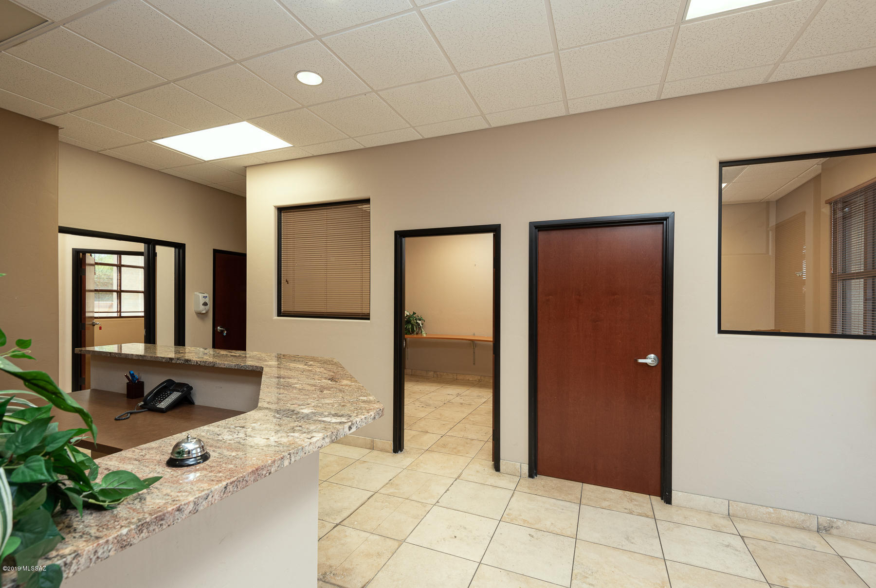 Class ''A'' office space in La Cholla Corporate Center ready for immediate occupancy. Enjoy travertine floors, stain-grade wood doors, built-in reception desk with granite countertops, break room countertop with sink & workroom with tons of storage cabinets. The space also includes 4 covered parking spaces, a large covered entry patio and rare back patio. Tenant to pay HOA fees of $695 per quarter, utilities & janitorial. Landlord to pay for property taxes, building maintenance & insurance. This office space will not last long.