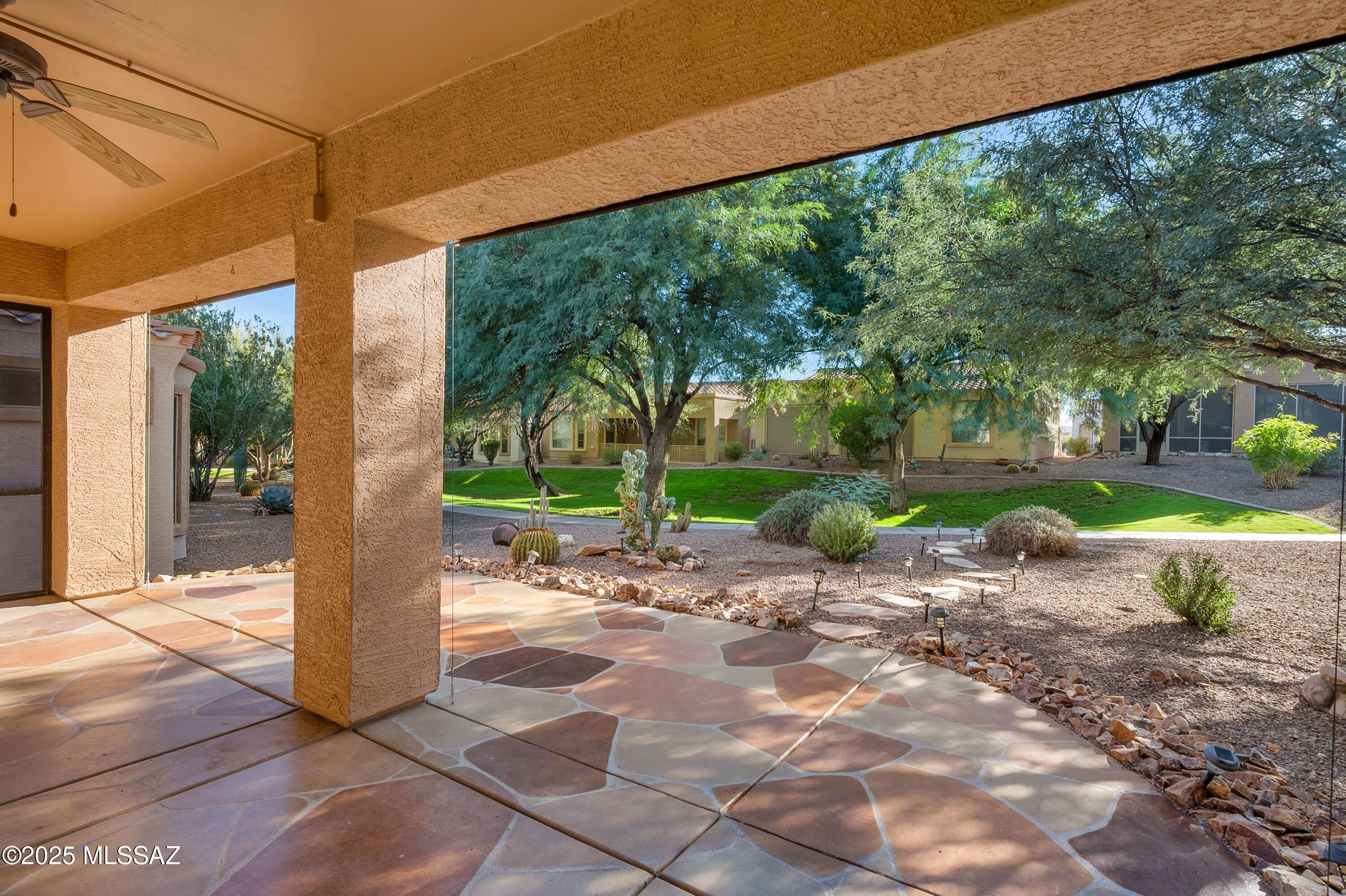 A lovely 2 bedroom 2 bath in the 55  plus age restricted  gated community of Las Campanas Village in Green Valley . The seller has created a small area off the Primary to create a space of a office area . The only carpet in the entire home is in the primary closet. The home is located with a beautiful setting behind of open space and trees that are maintained by the HOA. The HOA will take care of the patio and natural desert landscape behind the home, trash removal, front yard maintenance limited cable TV. 
The very large kitchen has beautiful granite and plenty of cabinets and a large center island.
the home has a split bedroom floor plan for privacy when guest come to visit!