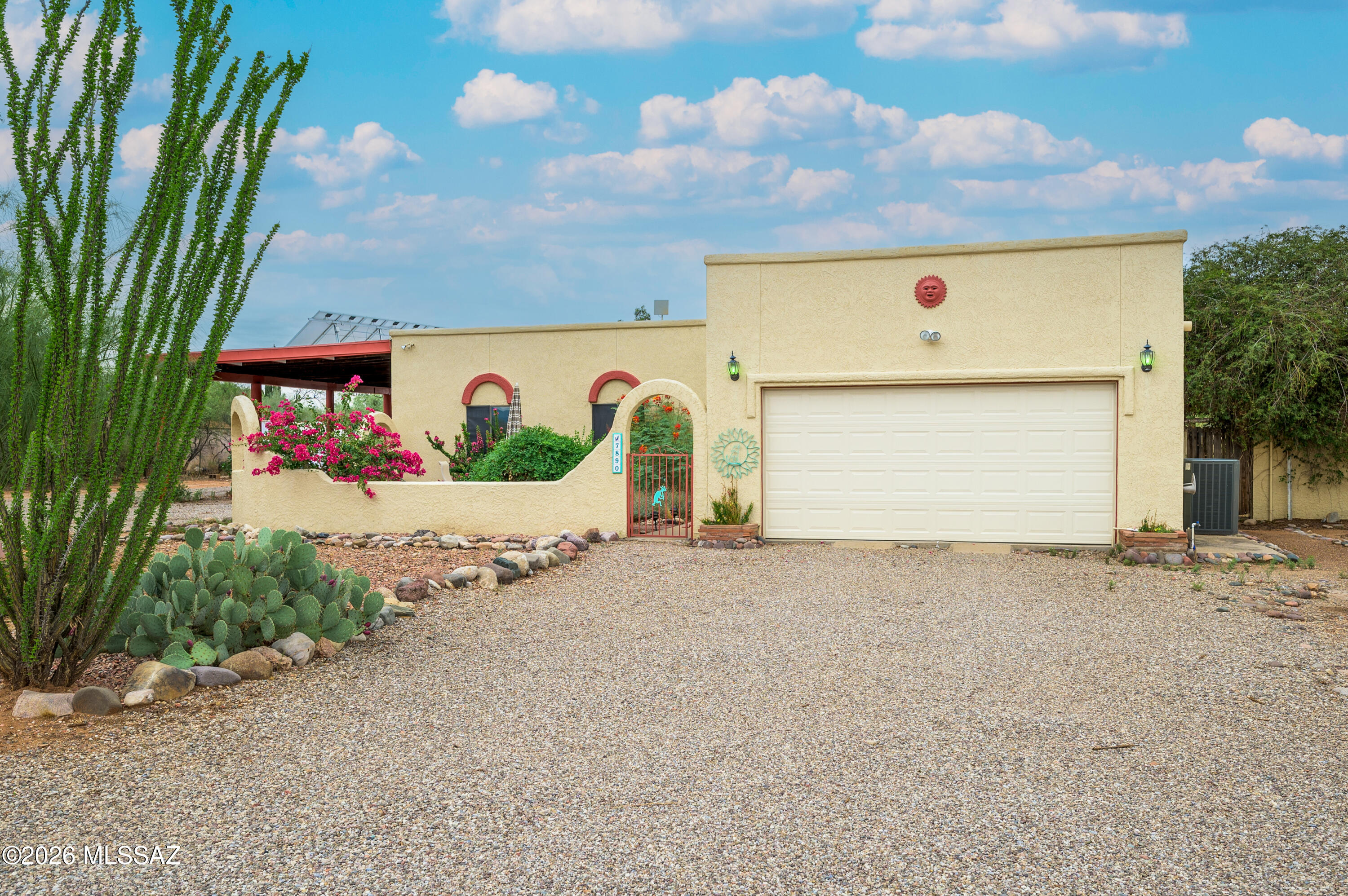 Rocking K Ranch Estates Retreat! Embrace the beauty of desert living from this spacious 3 bedroom Santa Fe-style home on a full acre lot with breathtaking mountain views! This home offers the perfect blend of comfort, privacy and Arizona charm. Spend your days relaxing in your private, block-walled backyard with sparkling PebbleTec pool, flagstone patio & pergola or entertaining as you enjoy vibrant desert sunsets. This generous, level lot offers plenty of space for RV/boat parking, gardening or horses. Popcorn ceilings have been professionally removed, textured and painted. New or recent replacements/improvements include: mini-split in AZ room, sliding glass door in front room (breakfast area), garage door w/remote, poles in carport, roof re-coated, leach field. The water heater has a rec The water heater has a recirculating pump. Pool has auto-fill and in-floor cleaning system. Umbrella holder in the wide step of pool. Large area with high fence could be great for pets. Stairs provide easy access to roof.