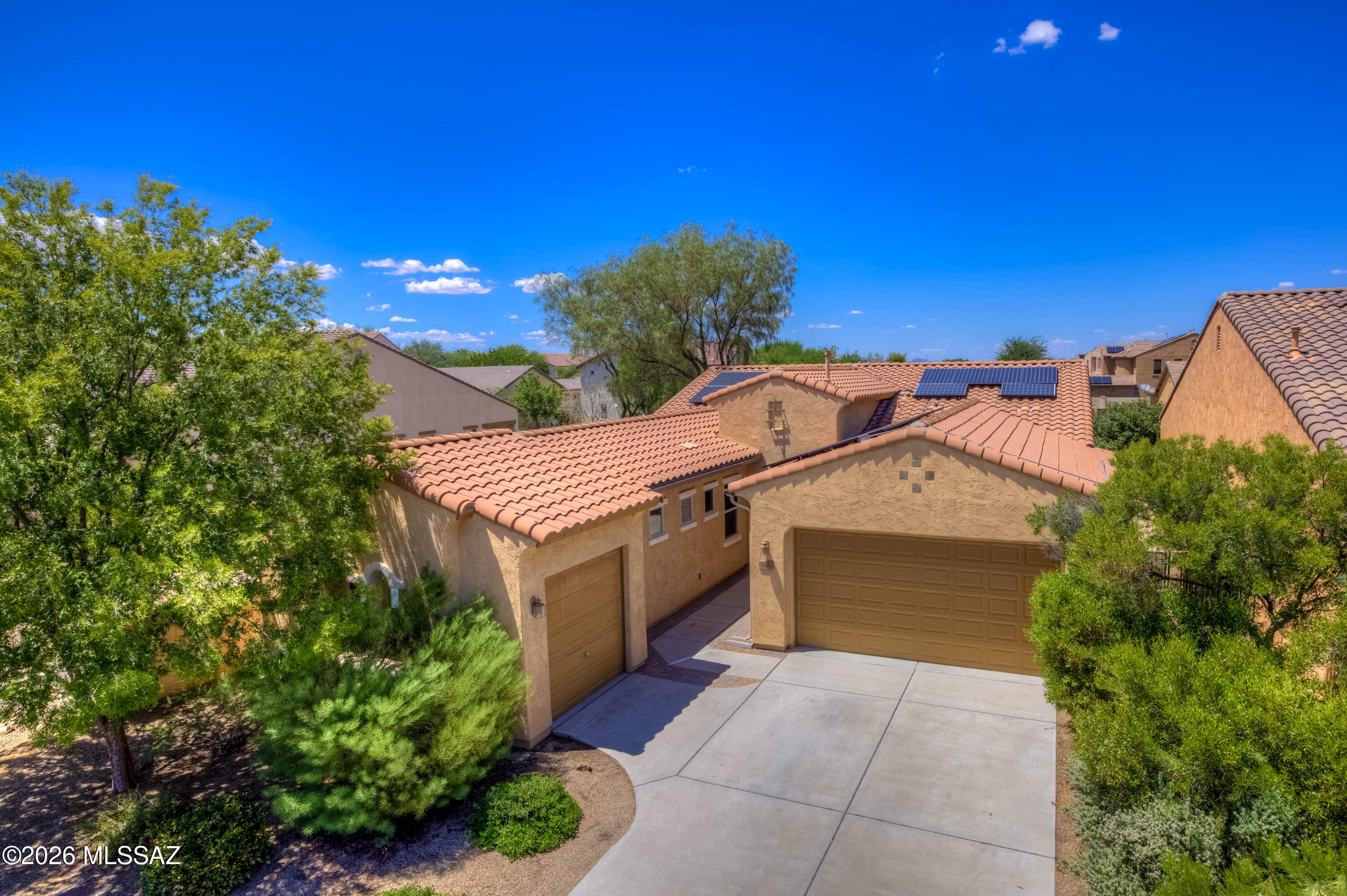 Well located in a private gated subdivision near everything, to include walking distance to the K-8 Anza Trail, this spacious 3 car garage home with amazing opportunities; imagination is the key. Spacious entryway leads into to a welcoming floorplan. A formal dining room with a wine cooler and convenient bar space, 4 bedrooms, and a hall bathroom with a tub/shower combination. The primary suite offers a luxurious retreat with dual sinks, a walk-in shower, a soaking tub and a large walk in closet conveniently connected to the laundry room. This open floorplan with upgraded gourmet kitchen with custom cabinetry, granite counters w/ breakfast bar, gas range with stainless steel hood, double ovens, huge walk-in pantry, all opening up to a large family room and a large dining space. Read more! Walk outside to the backyard oasis to enjoy the paver covered patio, turf, trees, a garden space, and BBQ, perfect for relaxing or hosting guests. The location is unbeatable, complete with parks, Rancho Sahuarita Club House, Sahuarita Lake, close to shopping, dining and I-19.