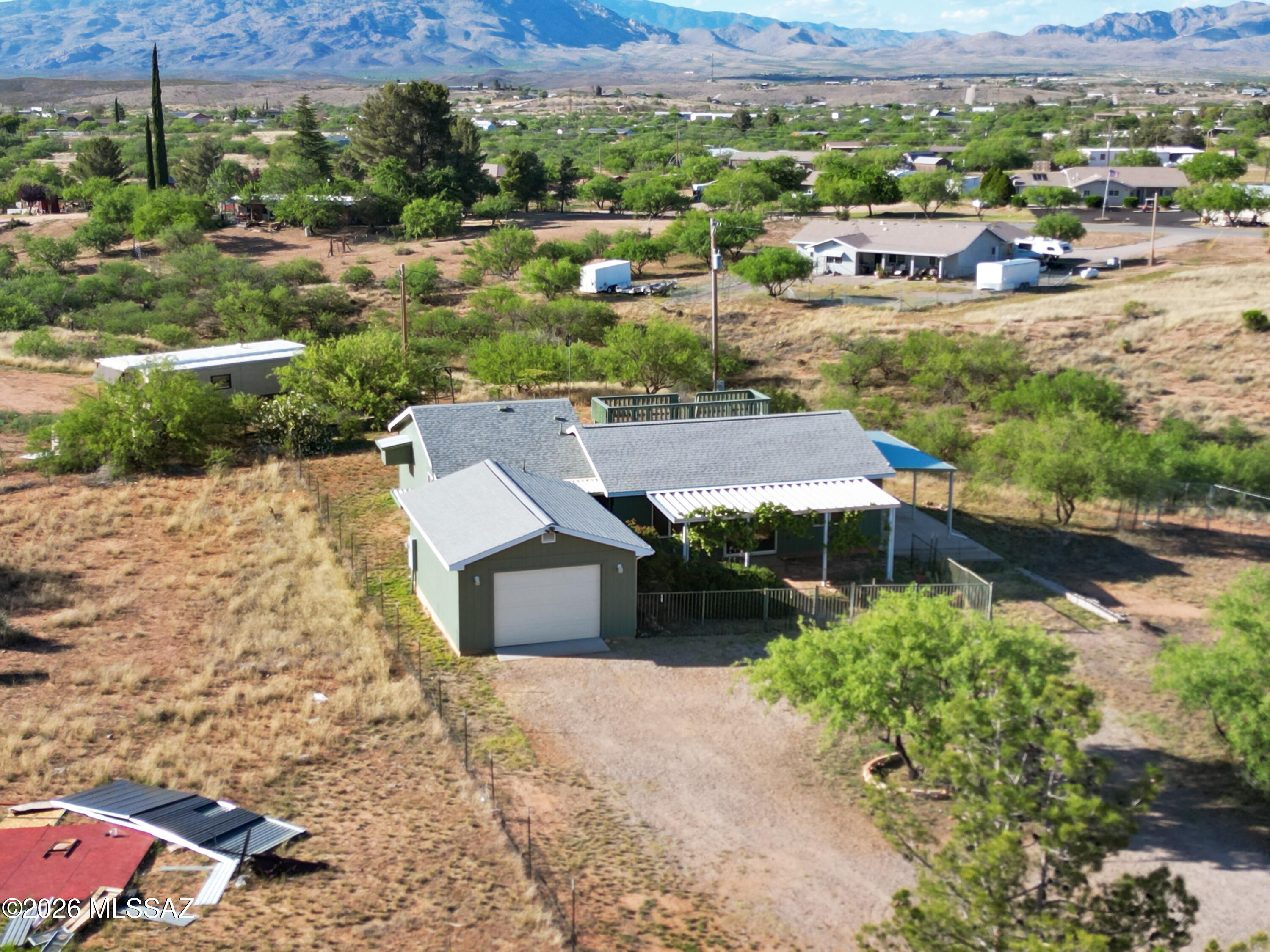 Charming 2 bedroom 2 bathroom home situated on 1.50 acres with a detached 1-car garage. Open concept great room offers a spacious and functional layout. enjoy multiple outdoor living areas including covered patios and a deck above the back patio, great for taking in the surrounding views. Property features natural vegetation and scenic desert landscape. Green connex storage container conveys with the sale.