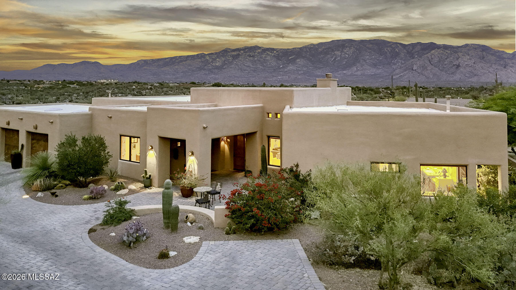 Located on a private 1.15 acre cul-de-sac lot including a conversation easement and backing directly to the scenic trails, natural beauty, and historic petroglyphs of Honeybee Canyon, this exceptional single-level custom home offers breathtaking Catalina Mountain views from the moment you enter through the front door.  Spanning 3,653 square feet, this thoughtfully designed split-floorplan residence features 3 bedrooms plus a den/office, 3.5 bathrooms, and a spacious 3-car garage with built-in storage cabinets, workbenches, and its own mini-split heating and cooling system.  The gourmet kitchen is designed for both entertaining and everyday luxury, showcasing top-of-the-line GE Monogram appliances, a commercial-style range, warming drawer, 60-bottle Wine Captain, granite countertops, custom cherry cabinetry, large island with prep sink, and hot/cold reverse osmosis water at the kitchen sink.  Elegant finishes throughout include travertine stone flooring, eight-foot solid Alder four-hinged doors, dual HVAC systems, dual water heaters with recirculating pumps, and a whole-house water softener.  The expansive primary suite captures stunning mountain views and features a cozy fireplace, luxurious spa-inspired bath with oversized jetted tub, and a stone-lined walk-in shower with dual shower heads.  Outdoor living is equally impressive with a covered patio, built-in BBQ, sparkling pool and spa, paver driveway and entry, and uninterrupted Catalina Mountain vistas.  Additional highlights include: single-story living with no interior steps; two guest bedrooms with private en-suite baths; spacious family room off kitchen; private desert setting with direct access to hiking trails; rare combination of luxury, comfort, privacy, and spectacular desert scenery.