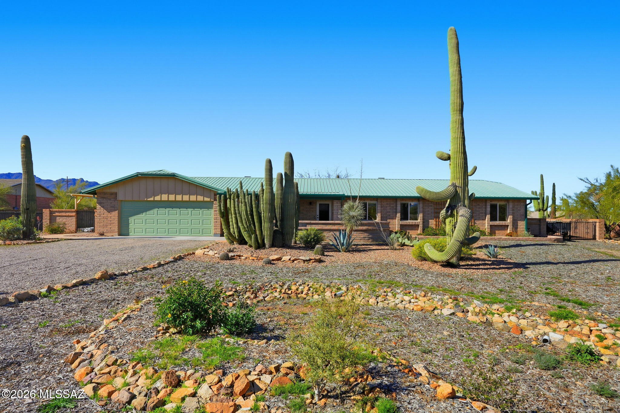 Tucked in a quiet, serene pocket of Del Cerro Ranch, this beautifully upgraded home sits on a spacious .83 acre lot and delivers stunning mountain views paired with true high efficiency living. From the moment you arrive, it's clear this property was designed for comfort, sustainability, and long term peace of mind.

This home showcases HIGH efficiency throughout, beginning with the ENERGY STAR metal roof two solar attic fans, R40 blown in insulation, Low E double pane windows, and a 6 kW owned solar system (16 panels). Durable Allura siding, an insulated front door, on demand gas water heater, 19 SEER Lennox heat pump with new ductwork, and a smart thermostat complete the home's impressive energy saving package. Every major system has been thoughtful to maximize performance and minimize monthly costs.

And while this home is incredibly efficient, it's also stunning. Inside, you'll find hickory hardwood floors, premium lighting, safety doors, and a custom built-in bookshelf with an electric fireplace that anchors the living space with warmth and style. The kitchen features a quiet 50 dBa dishwasher, easy clean microwave, print proof stainless steel refrigerator, and beautiful fixtures throughout. Bathrooms include dual flush toilets and upgraded faucets, and every room reflects pride of ownership and thoughtful design.

The outdoor living is just as exceptional. The expansive lot provides room to breathe, play, and entertain. Enjoy an extra large covered patio, an extended patio cover, a fenced dog run or garden area, fully landscaped front and backyards, and 2 RV gates  leading to the backyard perfect for toys, trailers, or future possibilities. With mountain views, peaceful surroundings, and clear night skies, this property offers a lifestyle that feels both private and connected to nature.

This is a rare opportunity to own a gorgeously maintained, highly efficient home in one of Tucson's most tranquil settings. Homes like this don't come along often don't miss your chance to make it yours.