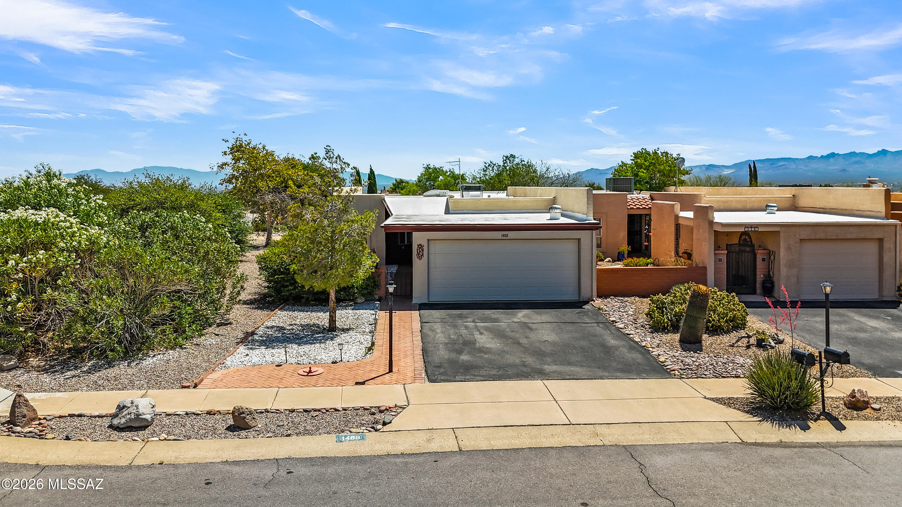 Beautifully renovated townhouse in the heart of Green Valley! This thoughtfully updated home offers 2 bedrooms plus a versatile den, making it just the right size for full time living or a seasonal retreat. The bright, updated kitchen features stunning granite countertops, gorgeous cabinetry, and an eye catching backsplash with plenty of natural light throughout. The main living areas showcase new luxury vinyl plank flooring. The den has built ins and the guest bedroom has a  murphy bed. Enjoy the added living space of the enclosed patio, perfect for relaxing year round. Situated on a desirable corner lot, this property also includes a 2 car garage, low maintenance backyard, and mountain views. This home can be sold furnished at no additional cost and best of all - NO GVR unless desired