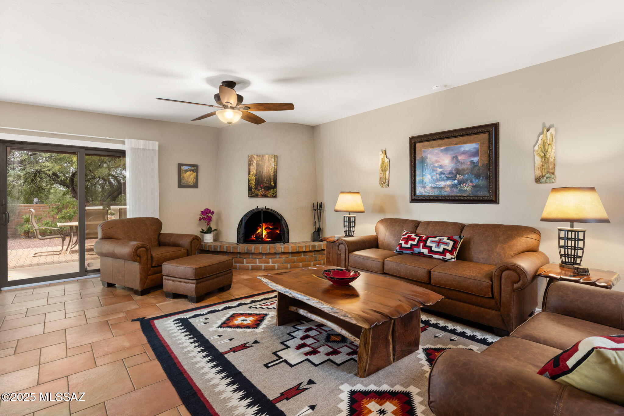 Welcome to Fairfield, one of the most sought-after communities in the Catalina Foothills where desert beauty and a true sense of community come together. This meticulously maintained Miramar floor plan sits on a large lot that borders common area with no neighbors directly to the south or behind you. 2 bedrooms plus a den, thoughtful updates including tile flooring throughout- no carpet, and the warm, inviting feel that makes a house feel like a home.
Picture yourself in the beautifully updated kitchen with rich Knotty Alder cabinetry, granite countertops, newer appliances and an abundance of natural light. From the kitchen sink, enjoy views of the lush, irrigated greenery and flowers that wrap around the side yard- an everyday reminder of how alluring this setting truly is. And to top it off, a breakfast nook makes the perfect spot to start your morning with coffee and sunshine.
The open living area is centered around a cozy wood-burning beehive fireplace, ideal for cool winter evenings. A built-in wet bar makes hosting easy, while skylights fill the space with soft, natural light. Anderson windows and sliding glass doors, a 2018 Trane 2-stage HVAC system, and owned solar (installed 2020) ensure efficiency, comfort, and peace of mind year-round. Terra cotta colored tile flow through the home- no carpet. 
The split bedroom layout offers wonderful privacy. The primary suite includes a sliding glass door to the backyard patio, an ensuite bathroom, and an expansive walk-in closet with two stylist mirrored doors. The versatile den is great as a home office or creative space for artists and musicians. The guest bathroom has been tastefully updated with a tile walk in shower and leads to the guest bedroom- complete with its own private patio your guests will love. A true bonus is the extended garage, offering abundant shelves, storage space and a workbench area. Outside, the patio wraps around the front, side and back of your home with brick pavers to enjoy outdoor living. The mature greenery is fully irrigated keeping your yard looking fresh and vibrant. Residents enjoy a community pool and spa with gorgeous mountain views, pristine pickleball and tennis courts, and a variety of social activities including monthly coffee clubs and more! HOA fees conveniently include garbage collection. All of this is just minutes from the River Center which has Whole Foods, Petco, dining options and more. Also down the road is La Encantada Mall- your outdoor boutique shopping mall with fine dining, clothing stores and everyday conveniences