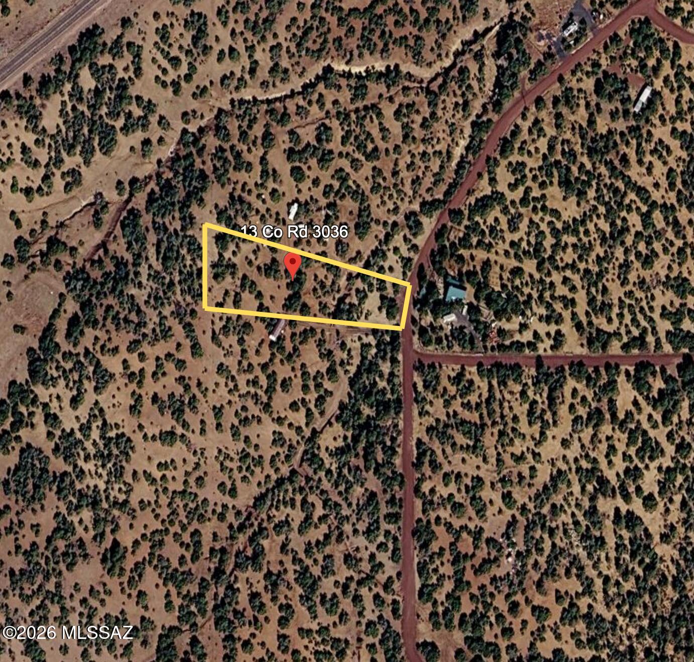 Quiet, usable 1.36-acre homesite in the trees just off County Road 3036 in Concho. This gently rolling parcel offers a cut-in driveway and leveled pad area, giving you an easy start for your RV, weekend getaway, or future cabin. Mature junipers provide privacy and shade, with open pockets that frame the surrounding high-country views. Power is available at lot line (buyer to verify connection and costs), and the property is zoned for flexible rural living with room for animals, gardens, and outbuildings, subject to county approval. Easy drive to Show Low for shopping, dining, and services. This is a great spot for someone who wants elbow room, trees, and straightforward access without being miles down a rough two-track. Buyer to verify zoning, utilities, access, and all intended uses.