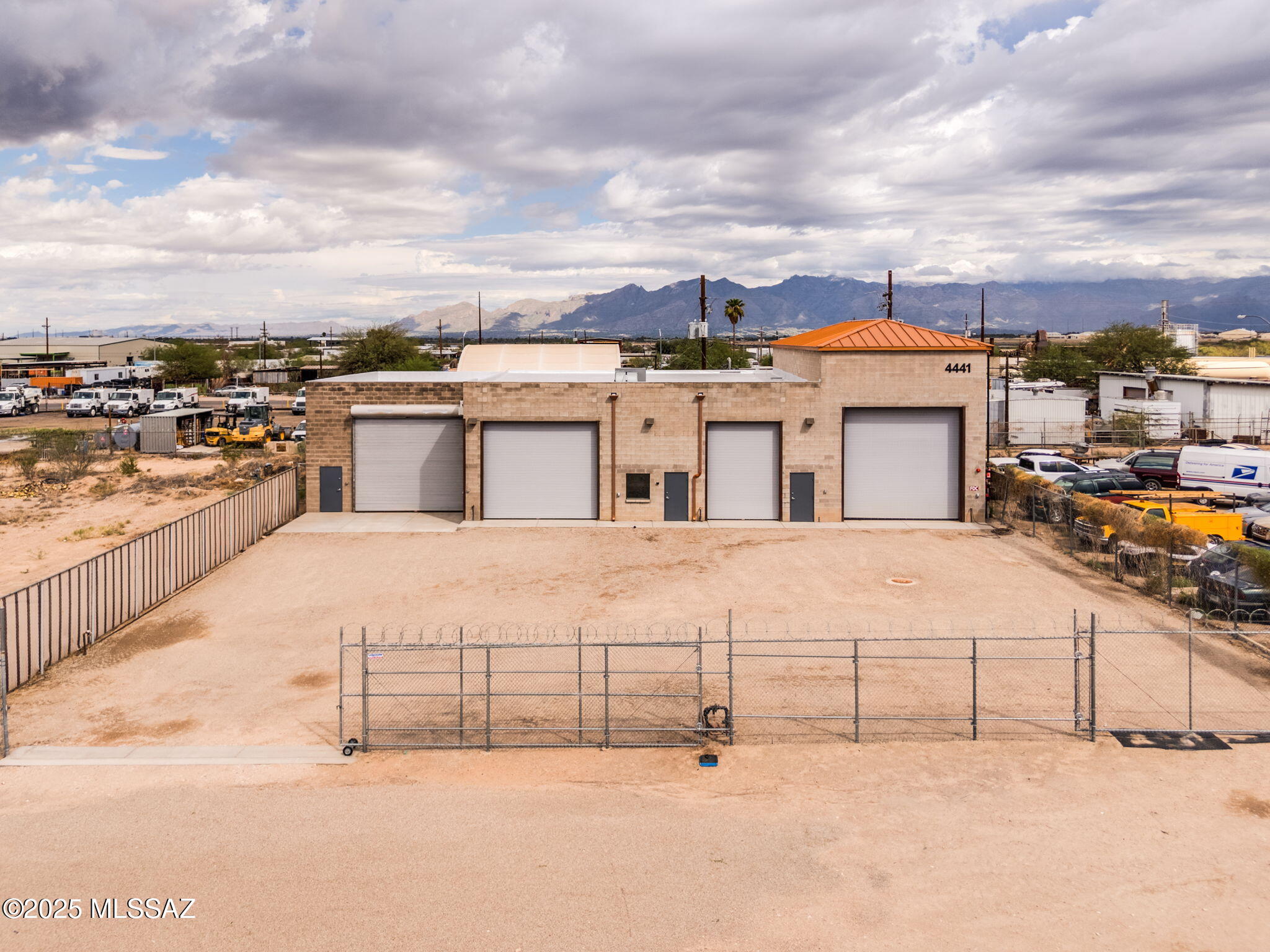 Investment Opportunity:  Versatile C-2 Zoned Commercial Flex Property in Prime Industrial Tucson Location. 

This exceptional merged double-lot commercial property offers a total of 4,685 square feet of flexible industrial space, thoughtfully expanded from a 1,000sf original structure built in 1987, via an additional 3,685sf added in 2015. 

Ideally situated directly across from the new Tucson Electric Power campus and historic power plant, this location features convenient access to I-10, enhancing connectivity and logistics.

Key features include:

* C-2 zoning allowing for a wide range of light industrial, commercial, and flex uses. * Recent 2025 upgrades: fire hydrant installation, concrete paving, recoated roof, fire safety equipment in all bays and offices, and secure chainlink fencing with dual rolling gates.

* Industrial-grade infrastructure: 3-phase electric (480v 1200 amp), mezzanine in 3rd garage bay, sandblast-equipped 1st/original garage bay for specialized uses.

* Elevated-clearance 24ft-high 4th garage bay with overhead crane readiness, metal built-up roof, and fire-rated fusible link power rollup doors for heavy industrial or manufacturing activities.

* Fully handicap-accessible bathrooms and modern rooftop HVAC system ensuring comfort and compliance.

* Rear concrete slab (14ft-wide) extends entire length of back property line, secured by 10-foot masonry wall, enabling ample outdoor staging, loading, or storage space.

* Hot water heater, hookups for refrigerator water/ice, and full bathroom with shower in mezzanine bay, all add convenient enhanced practicality & value.

This rare flex building combines industrial functionality with office capability under a durable, updated facility - making it ideal for manufacturing, distribution, service businesses, or specialty workshops seeking high-quality infrastructure. The proximity to major utilities and transport routes further enhances its long-term value for users or investors.