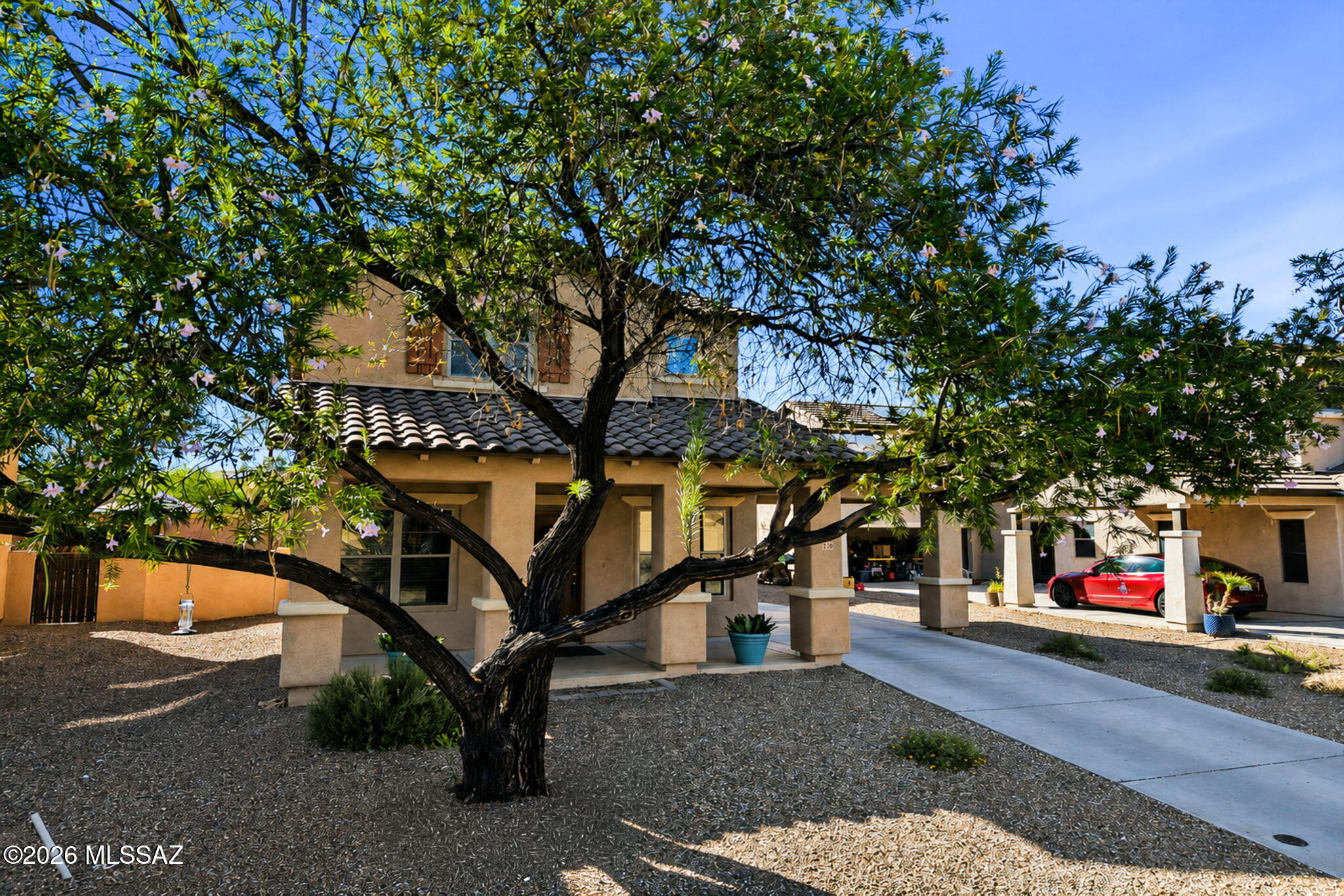 Step into this two-story charmer where sunshine does more than brighten your day--it slashes your energy bills thanks to solar power! Boasting three bedrooms, two and a half bathrooms, and 2,095 square feet, this home offers a versatile loft ideal for movie nights or that hobby you keep promising to start. Park with ease using the two-car garage plus carport, then unwind in the generous backyard beneath endless desert skies. Parque del Martin sits just around the corner, with Sahuarita Middle School nearby. Come see it before someone else does!
