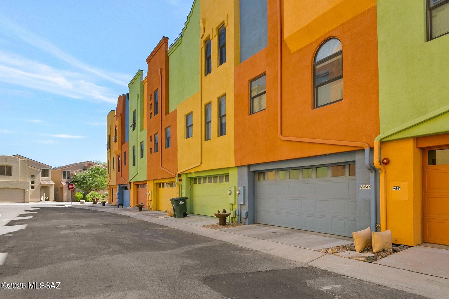 VA ASSUMABLE LOAN! $299,000 BALANCE AT 2.25%!  Experience elevated desert living in the highly sought-after gated Riverwalk community with this beautiful luxury townhome in Tucson's prestigious lower Foothills. Perfectly positioned just steps from the Rillito River Park and St. Philip's Plaza, and only minutes from La Encantada, the University of Arizona, and Downtown Tucson, this exceptional residence offers the ideal blend of urban convenience and upscale resort-style living. Originally custom built with quality craftsmanship throughout, this spacious home features a bright, open, and airy floorplan with multiple en suite bedrooms, luxurious bathrooms, expansive living spaces, and a versatile loft/den area with private balcony access. integrated shades, granite countertops, quality appliances, custom concrete flooring, wood-look ceramic tile, crown molding, Venetian plaster accents, and designer touches throughout. A private residential elevator services all levels, creating effortless everyday living. The showpiece rooftop deck was extensively remodeled to maximize outdoor entertaining and now features a custom outdoor kitchen area with breathtaking mountain and city views. Additional upgrades include high end HVAC systems, water heater, rolling shutters, water purification system, blackout shades, hidden AV conduit wiring, and and abundance of seller improvements.
Residents enjoy exclusive access to the private clubhouse, fitness center, resort-style pool and spa, along with direct access to miles of walking and biking paths along the Rillito River (The Loop). This is a rare opportunity to own an exceptional luxury residence offering sophistication, comfort, convenience, and incredible value in one of Tucson's most desirable locations.