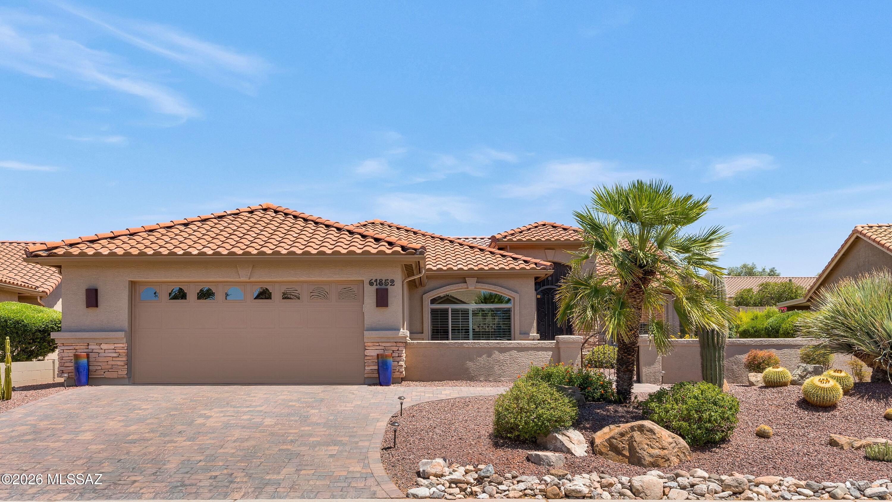 Beautifully Updated Laredo with Mountain Views! Roof underlayment replaced 2022! Paver driveway, courtyard & pathway lead to entry gate. Great Room has media wall with TV & patio slider. Kitchen offers quartz counters with tile backsplash, black stainless appliances, soft-close cabinets with slide-outs & dining area. Owner's Suite has bay window. Ensuite Bath has quartz counter, tiled walk-in shower & walk-in closet. Den/Office. Guest Bedroom with closet. Guest Bath has quartz counter & tiled shower. Laundry Room with W/D & cabinets. Tile flooring & plantation shutters through-out. 2025 Nuvo Water Softener System. Extended 2-Car garage with 2016 HVAC, 2019 W/H & cabinets. Enjoy outdoor living in enclosed covered epoxy patio, extended paver patio with FP, lovely landscaping, & gated yard.