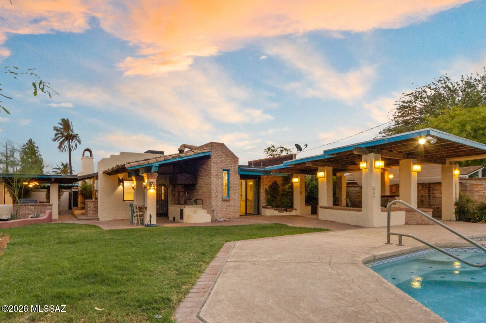 Tucson charm exudes from this home! From the moment you walk through the charming courtyard, inside to the remodeled yet comfortable spaces, and a magical backyard...you will say WOW!  Inside; 3 bedrooms & 3 bathrooms, a space for everyone! Exposed brick wall with fireplace, & Bright updated kitchen packs in all basic needs. Split bedroom floorplan with great sized rooms and access to backyard from 2/3 rooms. New AC (2024) Dual pane windows + Doors (2022) Tankless water heater (2022). Outside; Multiple covered patios, Pool/spa, Koi pond, Built in BBQ, sink and space to entertain. There is so much about this home that sets it apart from the rest! Nestled in Jefferson Park, this home is close to it all including UofA, Banner, Fine dining and so much more! Range Priced from $439,900-$459,900.