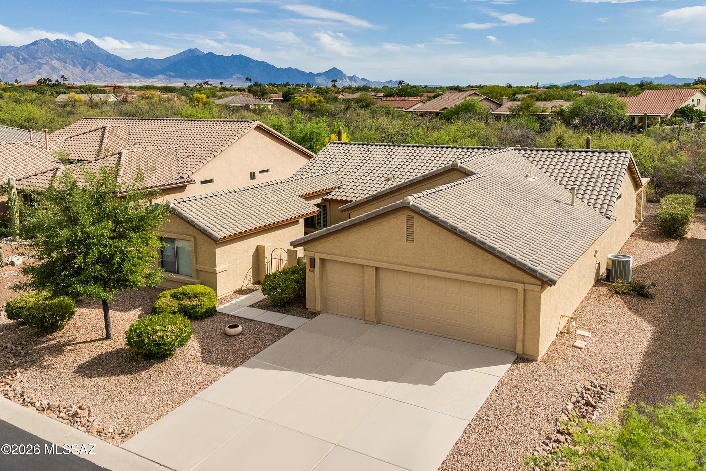 Expanded Laredo w/ Casita on a premium arroyo lot, w/ breathtaking views of the natural desert surroundings. Offering 2 BR, 2 BA and Den in the main house, plus Casita (3rd BR and BA), this 2,180 sq.ft. home is ideal for a houseful of guests. Bonus: golf cart garage! Inside are all tile floors and plantation shutters throughout, spacious great room w/ recessed lighting, display niches. Kitchen with SS appliances, island, pantry closet. Expanded dining space off kitchen. Owner's suite w/ dual vanity bath, walk-in closet. Den w/ doors offers extra privacy for use as a 4th sleeping room. Private entry casita w/ bath. End-to-end covered rear patio w/ gas BBQ stub. Rear yard backs to arroyo and natural desert where you'll enjoy mountain views and occasional visits from neighboring wildlife.