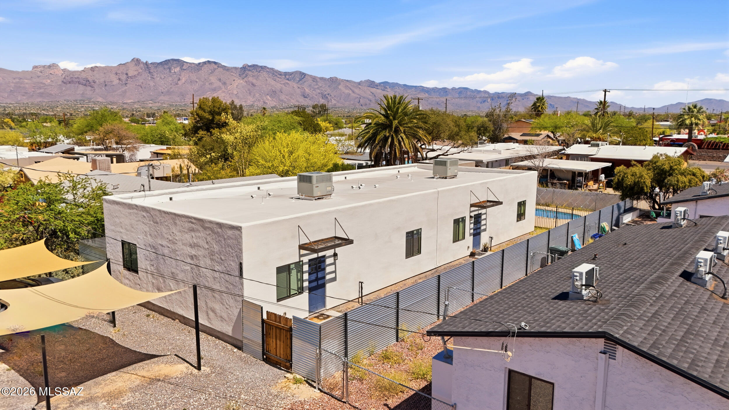 Live in one unit and let your tenant cover the mortgage, or rent both and cash flow from day one with this turn-key 2021 duplex. Each of the two fully separated 2BR/2BA units features walk-in closets, tile flooring throughout, in-unit laundry, and modern finishes. Separately metered utilities keep management costs low and tenant billing clean. Located just 2 miles from the University of Arizona and Banner-University Medical Center, the property sits in one of Tucson's most reliable rental corridors with steady year-round demand. With an on-site pool, zero deferred maintenance, and gross rents of $3,100 month, this is a rare turn-key investment at exceptional build quality.