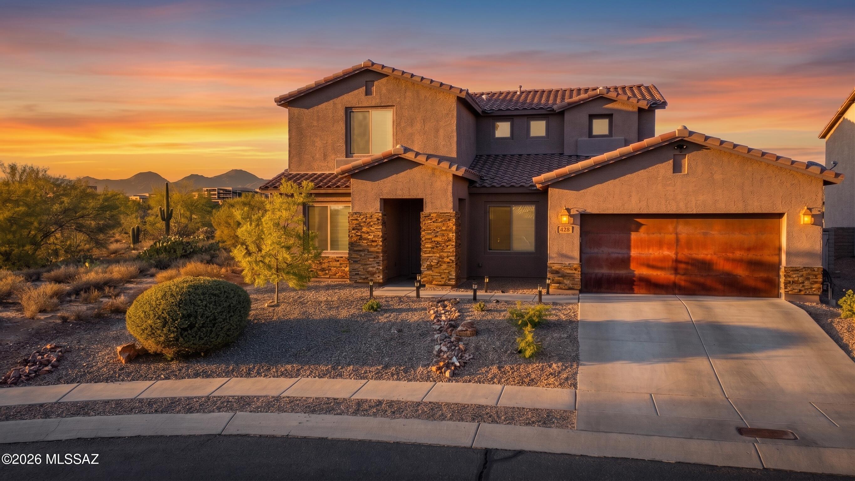 Tucked at the end of a quiet cul-de-sac in Marana, this four-bedroom, three-bathroom retreat delivers 2,868 square feet of seriously smart living. The floor plan flows beautifully, anchored by a kitchen that means business: a granite-topped island, gleaming stainless steel appliances, upgraded cabinetry, and a brand-new dishwasher ready for your next dinner party.

Now, let's talk backyard, because this one steals the show. Backing onto a protected preserve where nobody can build behind or beside you, the oversized lot offers privacy that's rare for the neighborhood. Picture yourself manning the built-in bar and grill while guests mingle, music drifting from in-roof Duron sound with crisp Klipsch speakers. Low-maintenance artificial turf keeps everything green without the weekend chores, and those legendary desert sunsets? They're included nightly, free of charge.

Inside, thoughtful upgrades add up fast: two new air conditioning units, fresh flooring throughout, recessed ceiling lights, and a striking oversized front door that makes a first impression. The three-car tandem garage even comes equipped with roughly three thousand dollars in overhead storage--your gear finally has a home.

Location-wise, you're minutes from Fry's Marketplace, Tangerine Sky Community Dog Park, and the championship greens of The Gallery Golf Club. The Ritz-Carlton at Dove Mountain sits close by for those splurge-worthy evenings, while Ironwood Ridge High School keeps families covered.

Built for entertaining and designed for everyday comfort, this one won't linger. Come see it before it's gone!