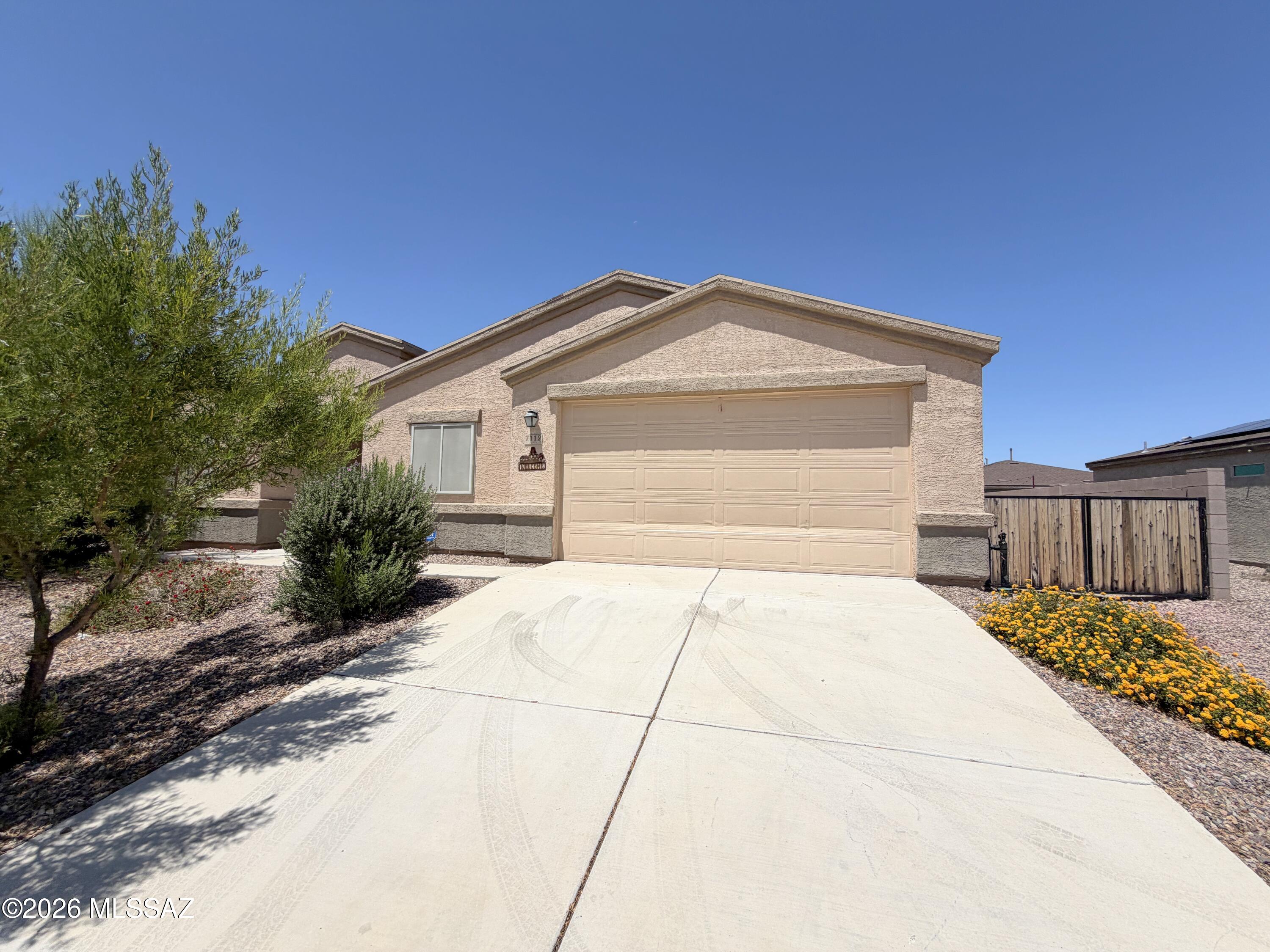 Spacious and thoughtfully designed, this single-story home offers 4 bedrooms, 2 bathrooms, 2,002 square feet, and a desirable split floor plan. The open-concept great room is filled with natural light and provides an inviting space for relaxing or entertaining. The kitchen is well-equipped for everyday cooking, featuring abundant cabinetry, granite countertops, a large breakfast bar for additional prep space, stainless steel appliances, and a gas range. The private primary suite includes a generous walk-in closet, walk-in shower, dual sinks with granite countertops, and a spacious linen storage area with shelving. Step outside to a large backyard with low-maintenance turf, ready for your personal touch with desert landscaping, shrubs, a garden, or other outdoor features.