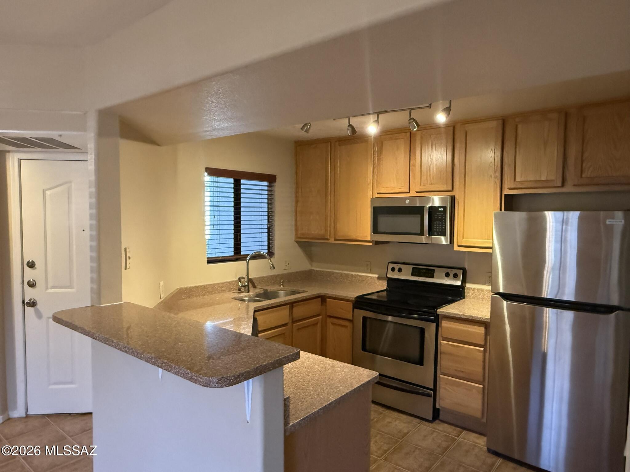 Enjoy resort style living near Ventana Canyon Resort and Sabino Canyon. This ground floor, split two bedroom/two-bathroom unit has a private patio, outside storage and walk-in closets. Interior boasts spacious great room living area. 24-hour gated community includes two heated pools with spas, fitness center, club house and mature landscaping. All in the shadow of the Catalina Mountains. Close to shopping, dining, hiking, golf +++!