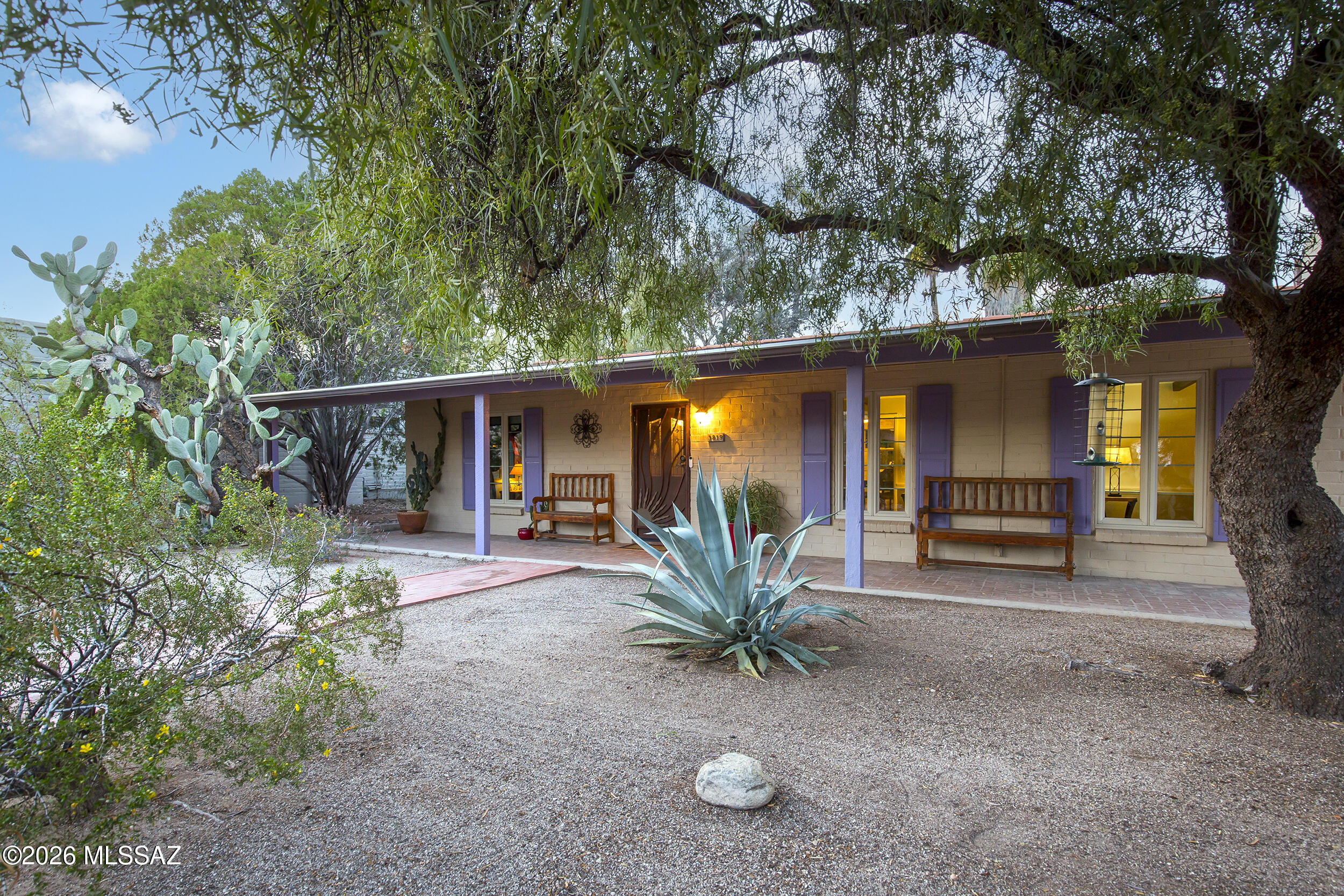 INCREDIBLE HISTORIC JOESLERESQUE STYLED RESIDENCE in the Coveted Central Oasis, El Montevideo Estates. Thoughtful attention to detail has been painstakingly dedicated to preserve the home's original character and architectural elements. Mid-Century charm abounds, plus enjoy proximity to all mid-town amenities- shops and restaurants. Home blends modern comforts with the refined character found in classic Tucson homes. Lovely pine beamed ceilings in living areas, Wood Burning Cone Shaped Fireplace, Secondary BR's share a Large Jack-N-Jill Bath with Classic Original Tile. Recent upgrades include a Newer Roof, Newer Ceramic Tile in all traffic areas, a Newer HVAC, Custom Security Door, + Rainwater Harvesting. Gorgeous 2024 Kitchen Remodel with New Cabinets, Quartz Counters, and New Appliances. The Gourmet Kitchen also offers a Pot Rack, Exposed Brick above the stove, and a Butler's Pantry. The Kitchen area flows into the Outdoor Patio area #1 with Brick Pavers, Outdoor Dining Area, Rainwater Harvesting, and Gutters connecting to the Rainwater Harvesting tank added. High Adobe Walls, Mature Trees, and Desert landscaping treat your guests to a "Blue Willow" like Patio Space. 

In the backyard, your guests will be surprised and delighted by the "Cantina De Jesus," which looks straight out of a movie set, but actually provides the homeowner with numerous outdoor storage areas and workshops. Could be potential for a guest house or casita- one would just need to add plumbing. (Electrical is already there). Workshop area has 220V- great for projects. Also a potting shed and numerous creative outdoor spaces- limited only by your imagination. 

Additional upgrades to the home include- All windows were replaced by Tucson Window and Door. Electric Box was upgraded in 2007. New Gas Meter and Water Meter. Water Heater replaced in 2019. Split System HVAC- front unit replaced in 2021- back unit replaced in 2020. ADT Home Security System with Security Cameras (Stays). Breezeway connecting wings of the house with stained concrete flooring. Primary Suite Wing was a previous addition and is Burnt Adobe construction, and contains the Primary Bedroom, Laundry + Storage. The Primary Bath was Remodeled with a Walk in Shower, and is spacious and bright. The primary wing also offers a separate Executive office space (or 4th bedroom) with wood plank floors, exposed adobe,  wood beams, and an old fashioned cast iron corner pot belly stove (stays). Entire house has numerous period built in cabinet and secret storage nooks/additional storage spaces. (When visiting check behind shuttered doors). The driveway has room to add on a single car, tandem carport. 

The backyard is a zen oasis with patio #2- a brick sitting area among tall mature trees, an outdoor brick fire pit, and a lovely metal ocotillo ribbed fencing. The beautiful backyard provides a peaceful oasis, and is also pool sized. 

This home was originally custom built for the former president of Valley National Bank. A rare offering in the classic El Montevideo Estates Community- it is a true Tucson treasure, with the money saving benefits of Historic tax status. The property also has one of only 57 remaining original Truly Nolen termite warranties from 1969. 

You'll love this location: it's just a short stroll to Locale for morning coffee, weekend brunch, or an elevated dinner. Midtown restaurants and shopping are minutes away, and the historic Sunshine Mile district is also close at hand. The home sits just 2.5 miles from the University of Arizona, and only 3.5 miles from downtown- offering quick access to everything from arts and culture, to major medical and employers.

Less than half a mile away is Gene C. Reid Park, Tucson's iconic recreation hub: run or walk the scenic 2-mile path, play one of two 18-hole golf courses, visit the Reid Park Zoo, wander the rose garden and duck pond, or take your dog to Miko's Corner Playground for off-leash fun. The Edith Ball Adaptive Recreation Center offers year-round swimming and wellness programs.

Welcome to your own Tucson Historic, Mid-town Oasis, where all the work has been done. Here, in the midst of a shaded Eucalyptus grove- you will find the perfect place to begin your next chapter!
