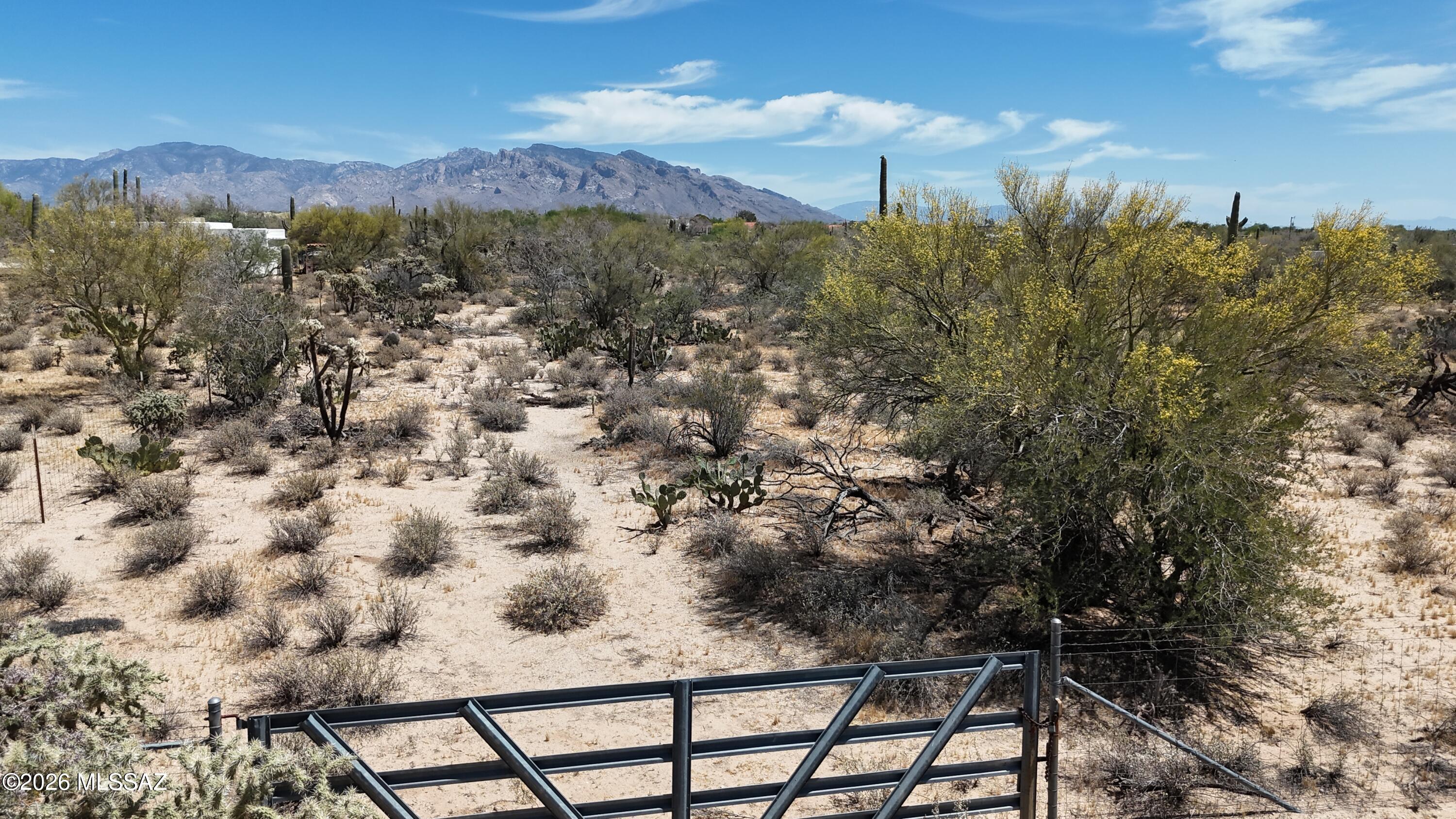 Exceptional opportunity to own 4.57 acres in the highly desirable Northwest Tucson area. This expansive parcel offers the perfect setting to build a custom home surrounded by established luxury properties, many ranging from $800K to over $1M. The lot features mostly level terrain with beautiful mountain and open desert views, providing both privacy and a peaceful natural setting. With water and electric available at the lot line, this property is ready for your vision--whether it's a custom estate, guest house, or private retreat. Located just minutes from shopping, dining, golf courses, and outdoor recreation, this property offers the ideal balance of seclusion and convenience. Don't miss this rare opportunity to create your dream home on acreage in one of Northwest Tucson!