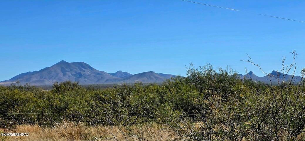 Amazing 360 degree mountain views. Ready for your dream homestead. Choose from stick built, manufactured or Builder Owner Opt Out options. Mostly level 4+ acre lot with power at the lot line. Cleared and leveled area to place your home.  This is the ideal location to build your dream home surrounded by peace and quiet with space for your home, workshop, barn, garden, horses, etc. Under 15 minutes to Sierra Vista's shopping and dining. Easily accessed not far off a paved road. 1/4 well share off of a working well at the corner of the property. Well water line and electric run along the north edge of the property. Offers peaceful country living without going off-grid. No HOA. Zoned RU-4. Fema Zone X.
