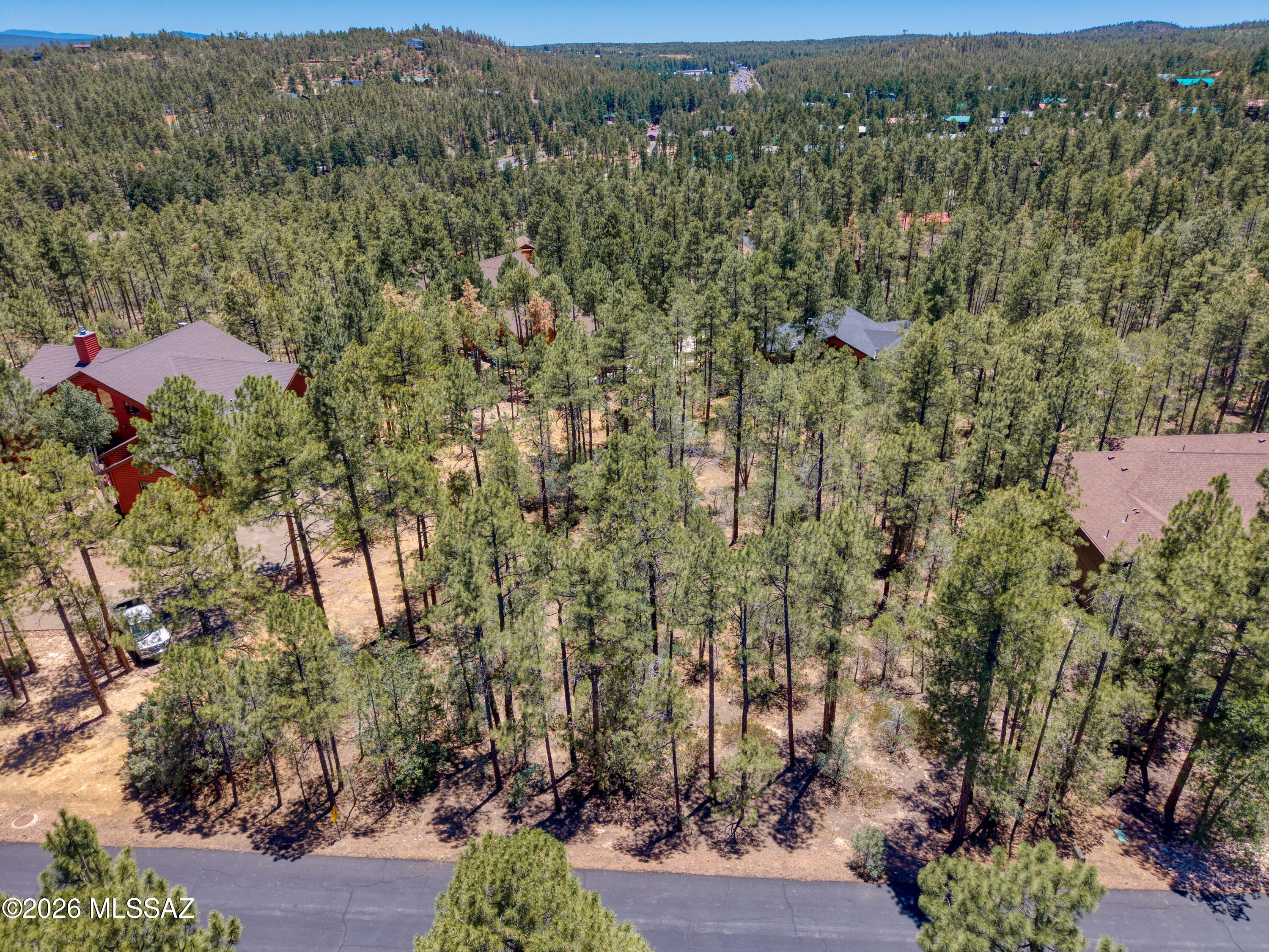 Wonderful opportunity to own a .57 acre lot in the highly coveted Pine Oaks Gated subdivision, one of the White Mountains' most desirable communities. This beautifully treed lot offers
a gentle slope to the rear that lends itself to potentially building your dream home with a walkout style architecture. In Pine Oaks you will enjoy a peaceful and secluded atmosphere
while being conveniently located near shopping, restaurants, medical care, and endless recreational activities. Power, Water, Sewer is available. An easy drive from the Phoenix and Tucson areas, don't miss this amazing opportunity to make wonderful memories for you and your family whether it be as a full-time residence or year round vacation get away.