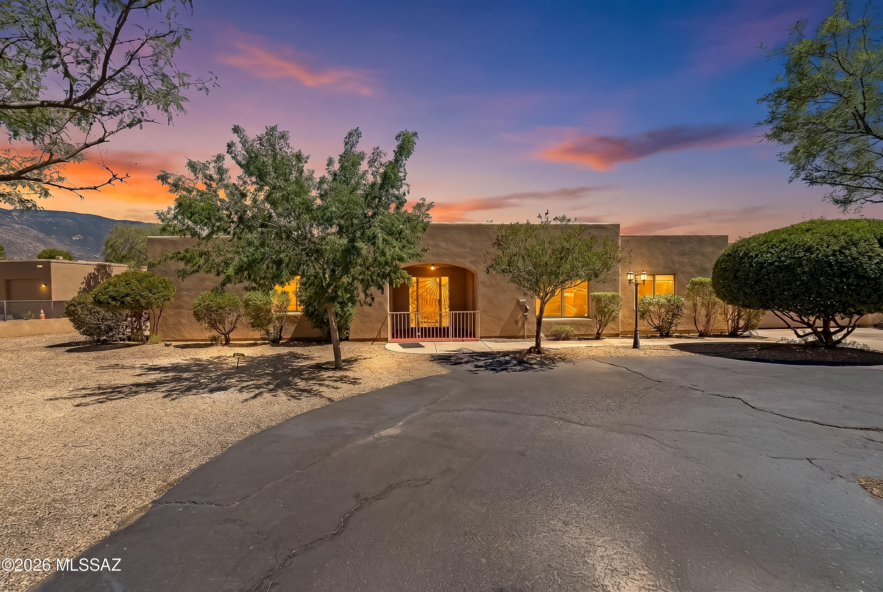 This stunning single-level home features an inviting open floor plan with ceramic tile in all the right places, with just over an acre of land this 4 bed, 2 bath home includes 1 guest bedroom with jack/jill bath. Step outside to an expansive covered patio designed for Arizona living, with panoramic views of the Santa Catalina Mountains creating a breathtaking backdrop for morning coffee, sunset dinners, & gatherings with family & friends. Enjoy the sparkling swimming pool, generous outdoor space, & seamless indoor-outdoor feel that make this home ideal for relaxing or entertaining. A large detached RV garage/workshop provides plenty of room for toys, tools, storage, or hobbies. With space, views, versatility, and exceptional outdoor living, this property is one you won't want to mis
