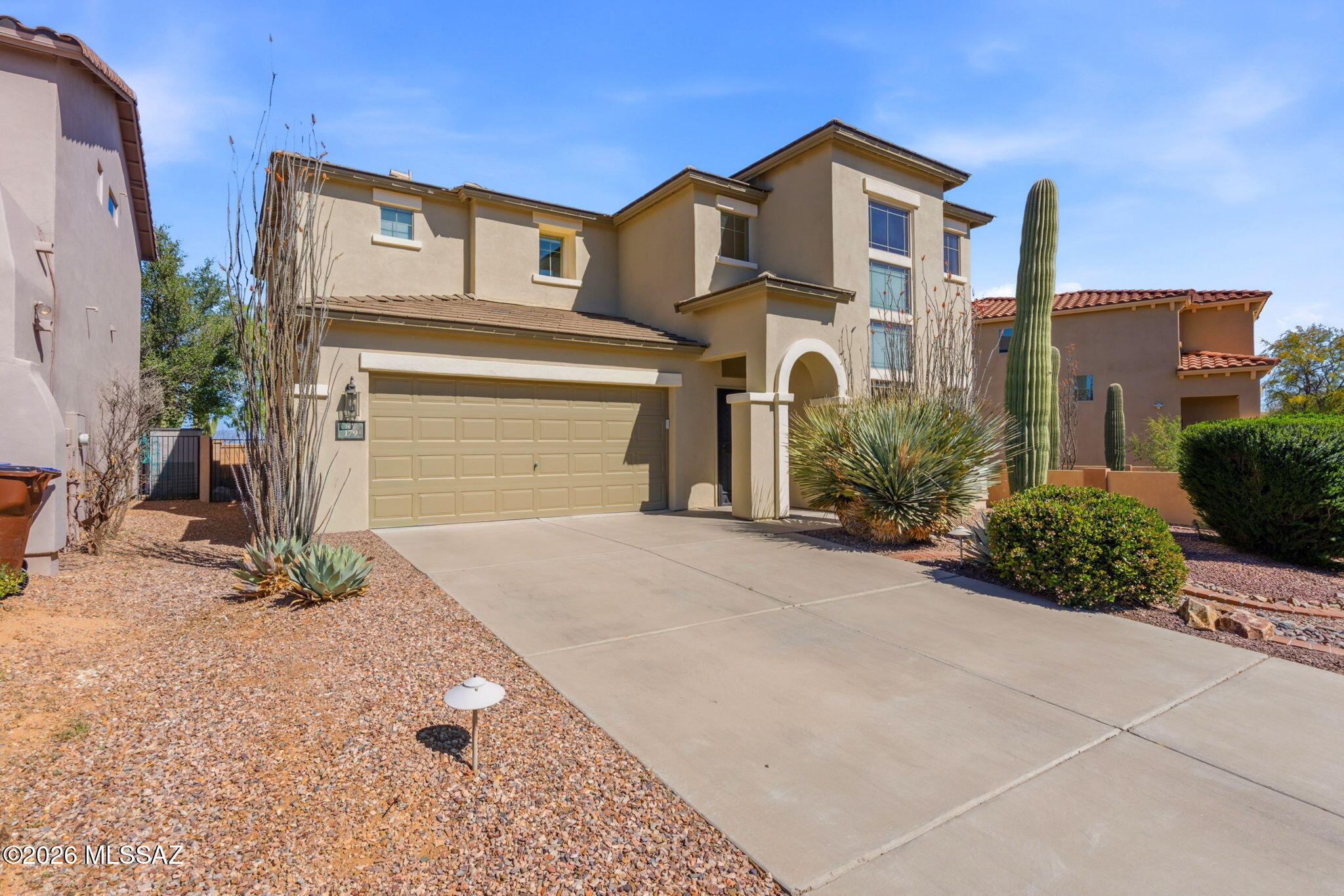 Former Model Home--Move In Ready, Backs to Common Area  with Mountain Views, New Plush Carpet !!! Tile Flooring in all Bathrooms & Laundry Room, One Bedroom and One Full Bathroom on the First Level, New Stainless Kitchen Appliance !!!! Extra High Vaulted Ceiling, Open and Bright, Exterior Painted in Jan 2025