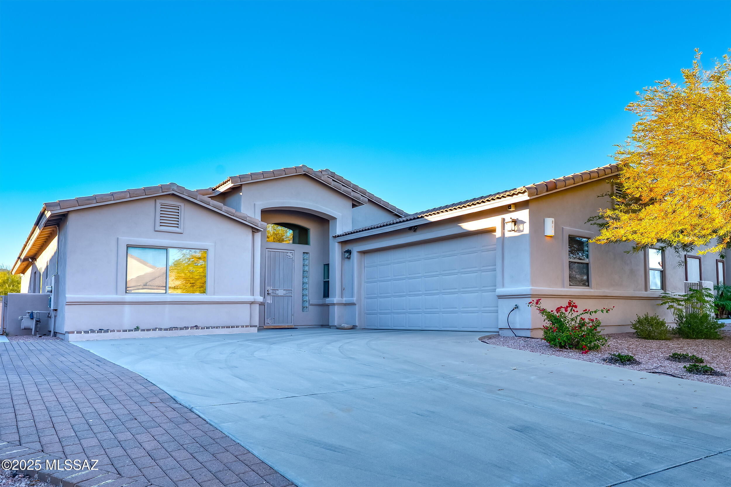Tucked into the Starr Pass Resort area, this thoughtfully designed custom home sits within Deer Crossing—an intimate enclave of just 29 homes surrounded by protected open space and the Tucson Mountains. The layout is open and easy, anchored by a well-appointed chef's kitchen that flows naturally into the main living and dining areas. The primary suite is a true retreat with its own fireplace, spa-style bath, and direct access to the covered patio and heated spool.
The backyard is designed for low-maintenance desert living, with turf, a fire pit, and plenty of room to relax or entertain under the stars. Just beyond the neighborhood is the Arnold Palmer Signature Starr Pass Golf Course, along with miles of hiking and biking trails through Tucson Mountain Park and nearby Saguaro National Park West. Despite the quiet, tucked-away feel, you're minutes from the JW Marriott Resort & Spa, downtown Tucson's restaurants and culture, the University of Arizona, Pima College, and the airport. It's a home that works beautifully as a full-time residence or an easy lock-and-leave escape, private, peaceful, and distinctly Starr Pass.