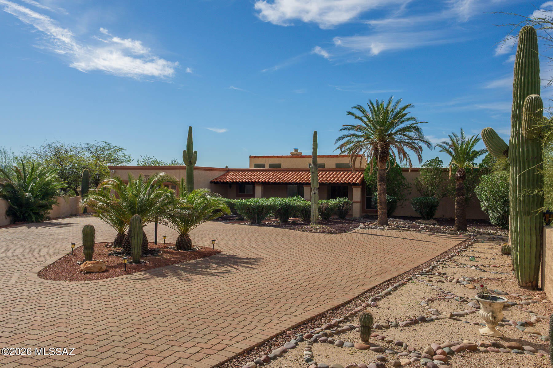 Discover a hidden gem where contemporary architecture meets timeless elegance. Nestled in the heart of the Catalina Foothills in the desirable community of River Hills Estates, this home offers privacy (cut-de-sac), mountain views and serene surroundings. No HOA. This property serves as the perfect canvas for your dream home. This home features a spacious layout with 3 bedrooms and 4 baths. Dual fireplaces create a cozy retreat, perfect for reading or quiet conversations. Enjoy outdoor living with a sparkling pool. The roof deck offers the best, elevated and unobstructed panoramic views. Great for star gazing or entertaining. Easy care landscape harmonizes effortlessly with Tucson's natural desert. Minutes away from Wholefoods, Natural Grocers, Walgreens and Sabino Canyon. Come see today