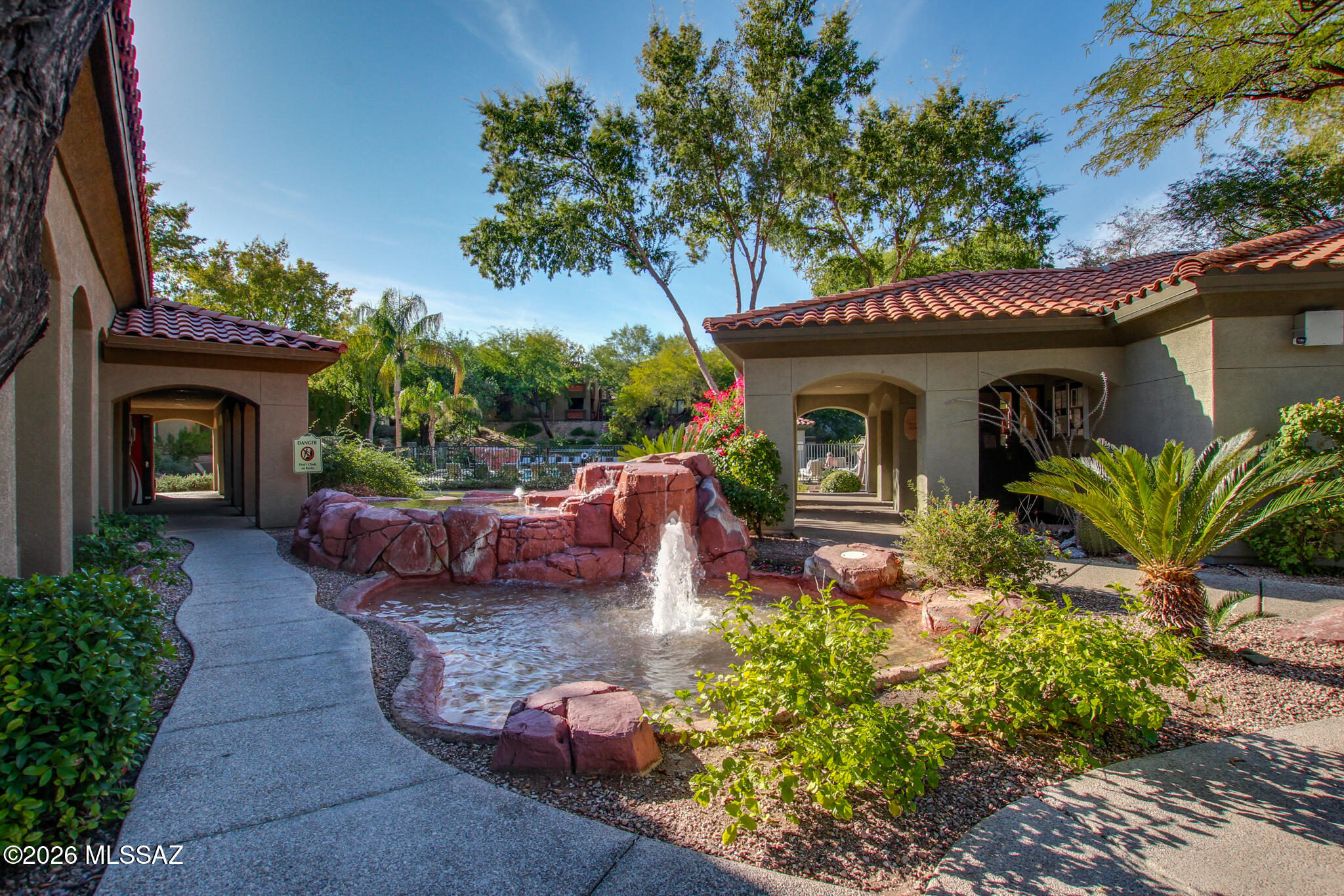 Enjoy resort-style Foothills living in this 2-bedroom, 2-bath condo located in the gated Veranda at Ventana community. This 944 sq. ft. home offers a functional layout, stainless steel appliances, an in-unit washer and dryer, and a private balcony surrounded by mature trees for added shade and privacy. Community amenities include two pools and spas, a fitness center, volleyball court, playground, and BBQ ramadas. Conveniently located near hiking, golf, shopping, and dining. A great option for a first-time buyer, seasonal resident, second home, or investment property. A transferable First American Home Warranty with HVAC coverage is included, providing the buyer with immediate coverage at closing.