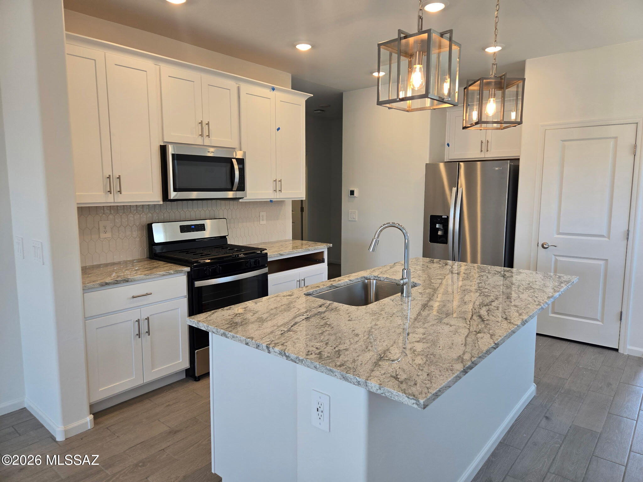 Experience effortless living in this beautifully designed open-concept home featuring 3 bedrooms and 2 bathrooms. A versatile flex room just off the kitchen offers the perfect space for a home office, playroom, or additional living area. The spacious primary suite boasts a generous walk-in closet for all your storage needs. Located in the sought-after Mandarina community in Marana, AZ, where future amenities include a resort-style pool, pickleball courts, playgrounds, a dog park, and more. Move-in ready with washer, dryer, refrigerator, and whole-home blinds. Built with innovative, energy-efficient features for comfort, savings, and peace of mind.
