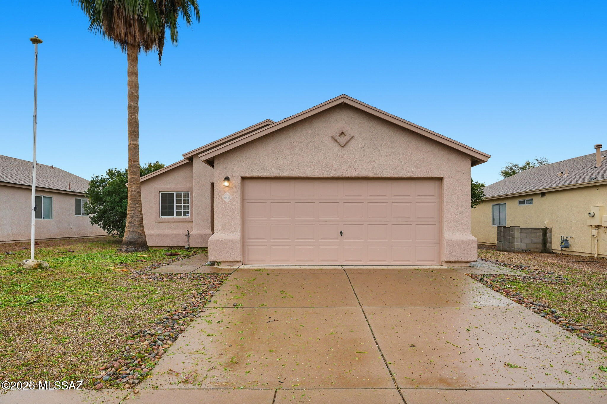 Move-in-ready home located in the desirable Wilmot Vista neighborhood. This well-maintained residence features a functional floor plan with fresh neutral finishes and great natural light. The kitchen offers ample cabinetry, generous counter space, stainless steel appliances, and opens to the dining area. Bedrooms are comfortably sized, including a primary suite with private bath and walk-in closet. Enjoy the covered patio and spacious backyard—perfect for relaxing or entertaining. Conveniently located just minutes from Davis-Monthan Air Force Base, Park Place Mall, dining, and shopping. A great opportunity and won't last long!