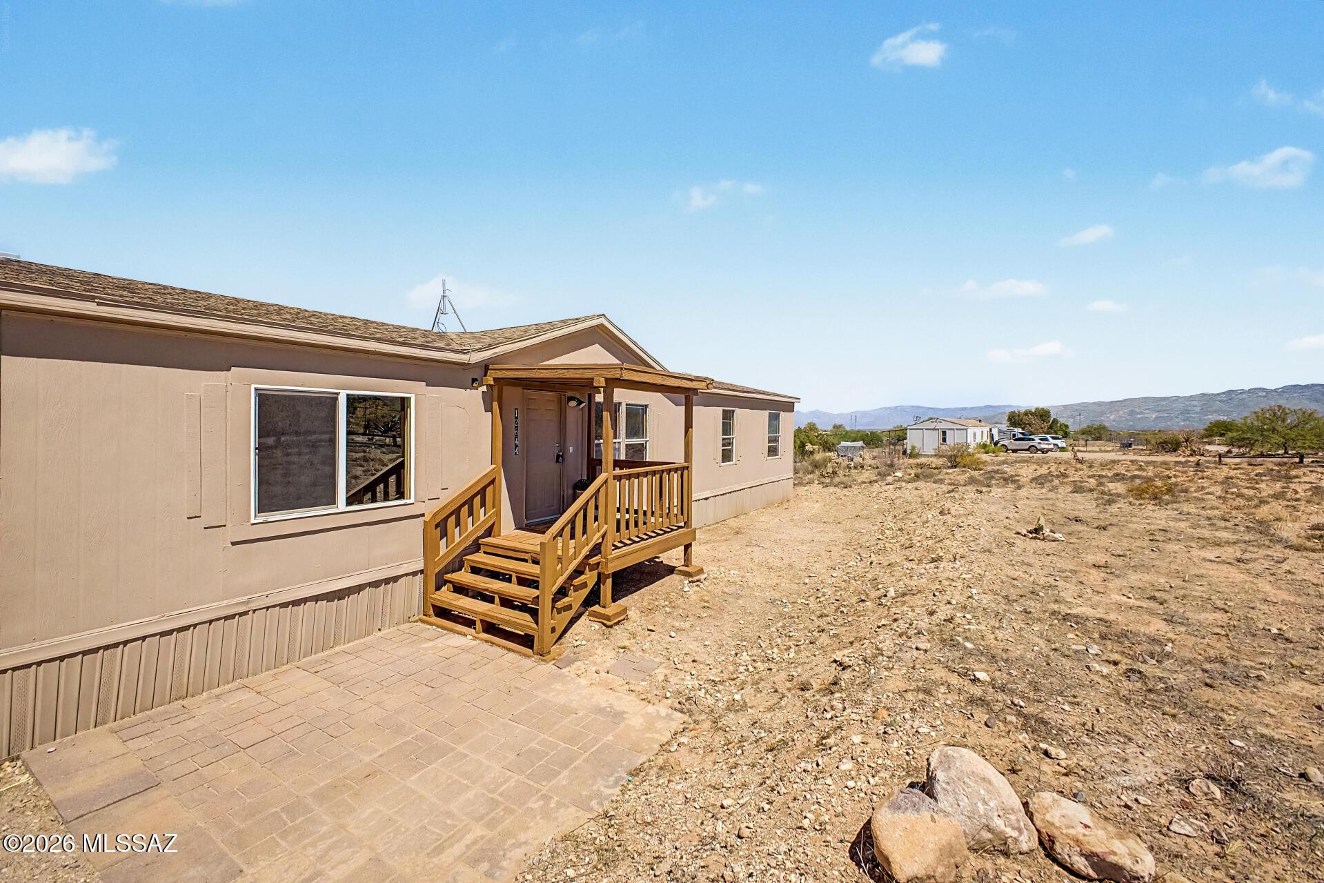 Enjoy peaceful desert living in this clean and well-maintained 4-bedroom home situated on a spacious 1-acre lot! Bring your RVs, trailers, ATVs, and all your desert toys with plenty of room to spread out and enjoy. Take in the beautiful mountain views and wide open skies while creating your own private outdoor sanctuary. This move-in ready home also features a brand-new 2026 water heater for added peace of mind. Whether you are looking for extra space, privacy, or room for outdoor living and entertaining, this property offers endless possibilities to make it your own while enjoying the beauty of Arizona living.
