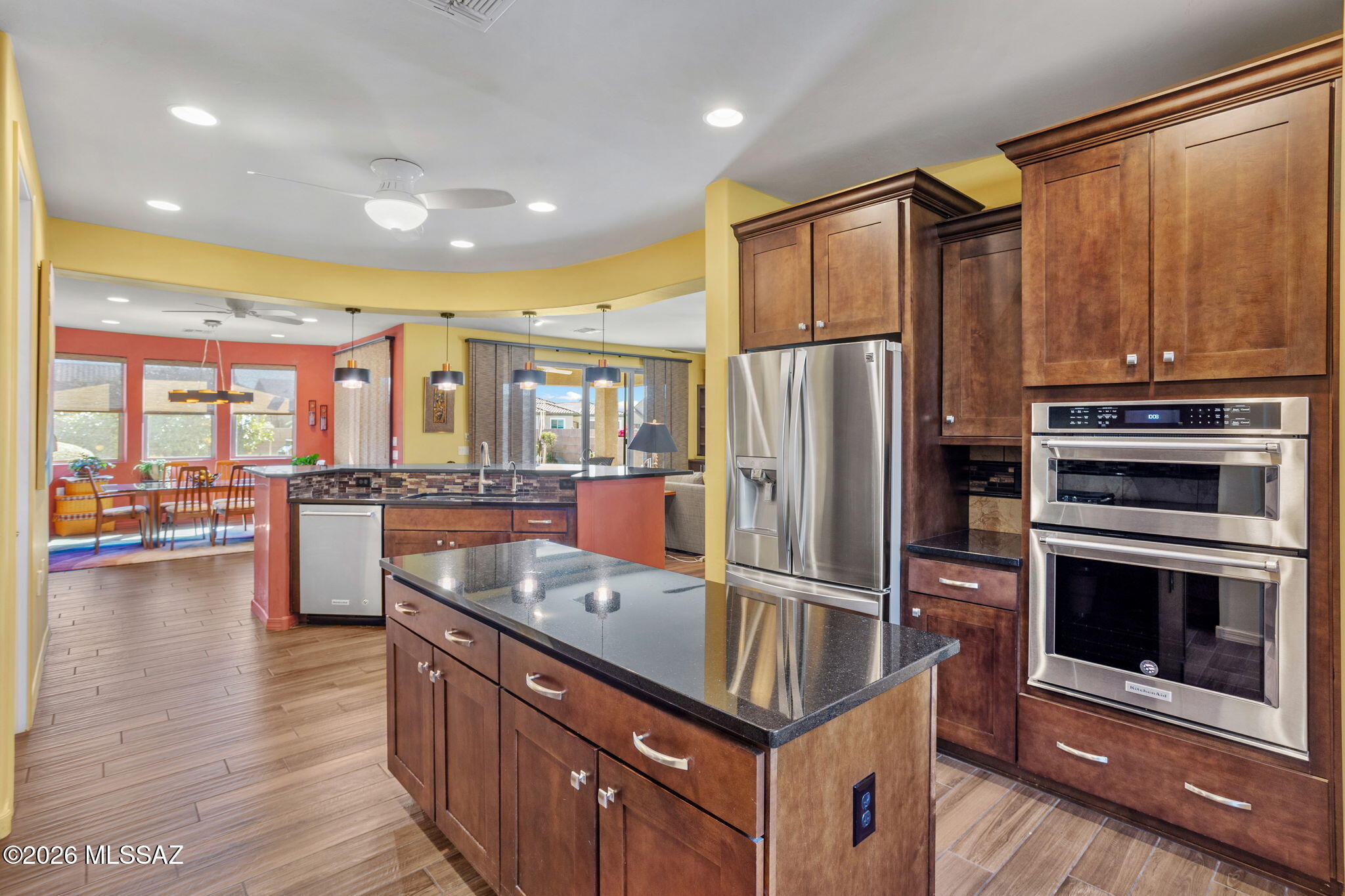 Two bedrooms plus two dens / two and a half bathrooms. Full 3-car garage on a cul-de-sac lot. Enjoy the easy maintenance of consistent wood-look tile throughout, no carpet. 8' interior doors. The gourmet kitchen layout includes dove-tail, soft-close cabinets and gas cooktop. Built-in cabinets in the den. Custom window coverings and California Closet organizers. Soft-water system, reverse osmosis drinking water, and tankless water heater. Beautiful backyard with built-in BBQ, water feature, and citrus trees.