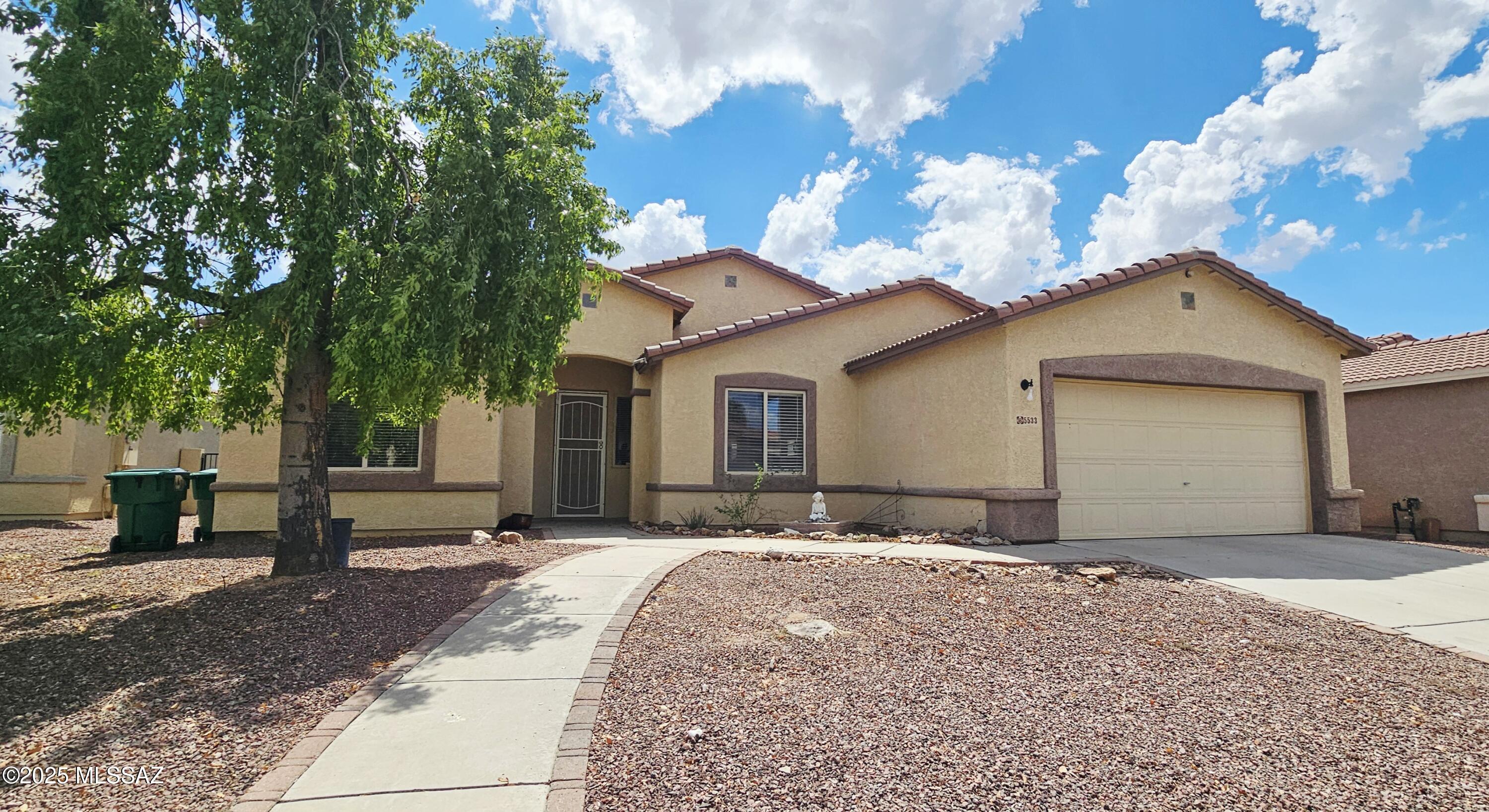 Conveniently located near I10, restaurants, shopping, medical facilities, this beautiful single-story home offers 4 beds 2 baths & 2-car garage. Step inside to an open split floor plan w/soaring vaulted ceilings that make the home feel even larger. The private primary suite features a walk-in closet & en-suite bath w/dual vanity, soaking tub & separate shower. The updated kitchen is perfect for both cooking & entertaining, showcasing granite countertops, stainless steel appliances, many cabinetry, breakfast bar & dining nook. The spacious living room offers built-in entertainment center for added functionality. Enjoy low-maintenance no-carpet flooring throughout the home. Step outside to a large backyard designed for relaxation & fun, featuring a covered patio, lush turf, basketball court.