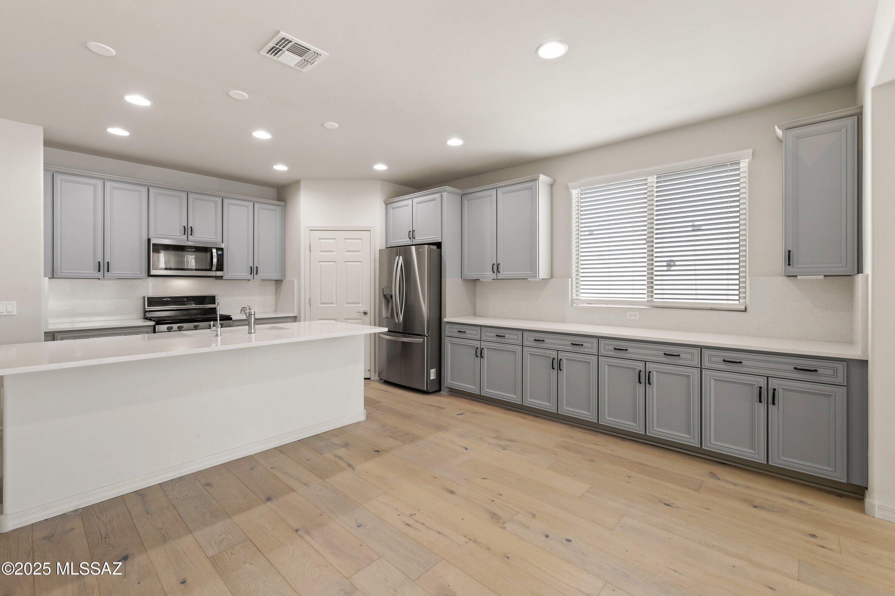 This beautiful Pulte built Barletta is stylish & smart. This modern gem in a quiet cul-de-sac features a split floor plan layout & primary ensuite that becomes your personal retreat. The kitchen? Total showstopper- with gleaming quartz countertops, upgraded pull-out drawers, high-end appliances and all the space that makes meal prep & entertaining feel like a treat. Outdoors, enjoy a paver patio, turf lawn, and palm trees framing breathtaking Rincon Mountain views. Added perks include a tankless water heater, reverse osmosis, and water softener. Take advantage of all that the Rocking K community has to offer from family events, pickleball, basketball, miles of walking/biking trails and close access to the brand new Saguaro Creek K-8 school.