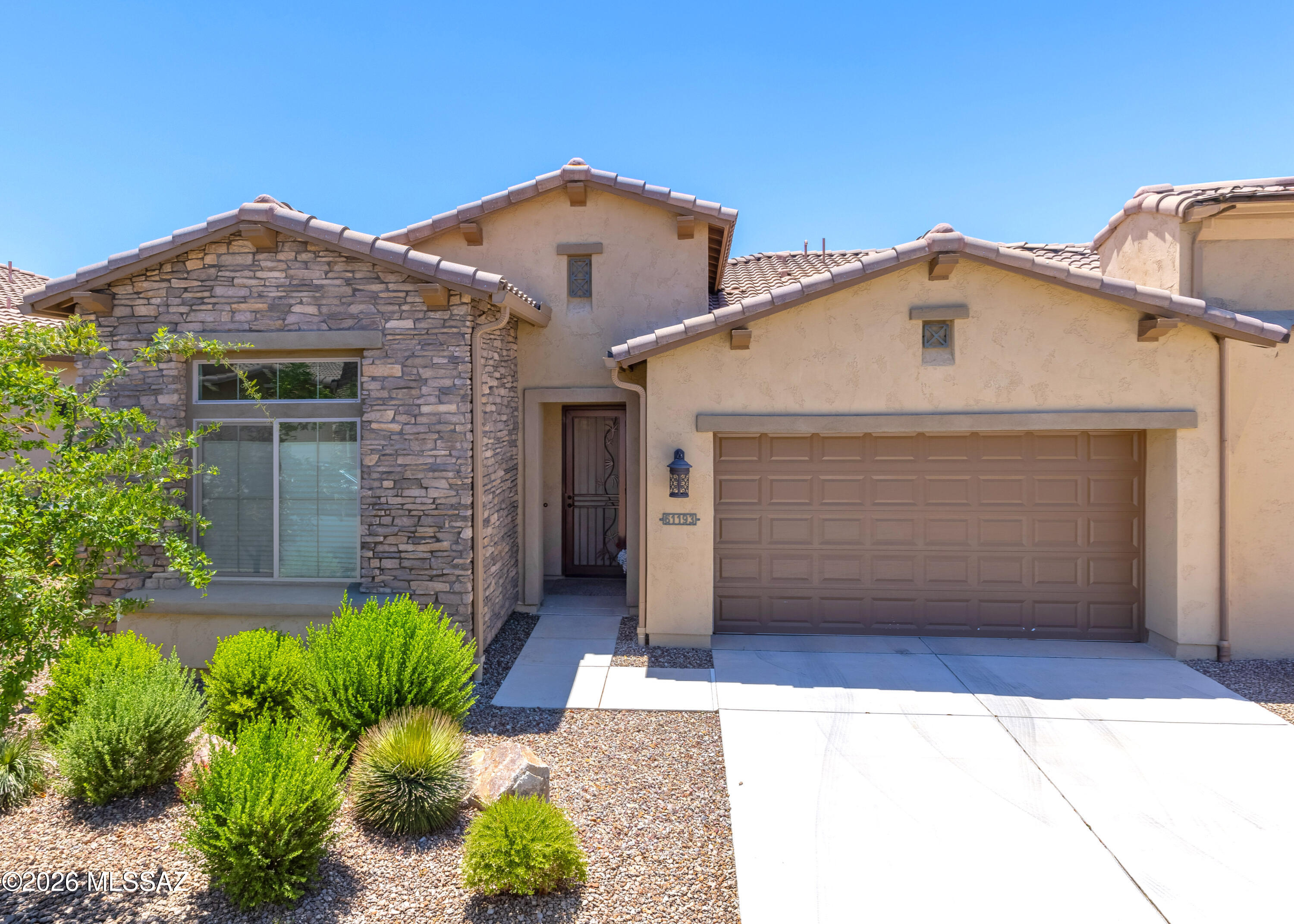 Settle into single-story living in this well-kept Lago model villa in SaddleBrooke Ranch, cared for by its full-time owner. Tall ceilings brighten the open-concept great room, dining area, and flex den, plus a split floor plan for primary suite privacy. The kitchen features granite countertops, upgraded cabinetry, a tile backsplash, a generous island, black appliances, a black stainless refrigerator, and an electric cooktop. The primary suite offers a walk-in closet and a 42''x60'' step-in shower, plus a separate laundry room for convenience. Enjoy the private, enclosed courtyard or covered patio. An attached 2-car garage, owned water softener, and HOA-maintained exterior, roof, and grounds keep upkeep low. SaddleBrooke Ranch is a gated, age-restricted 55+ community with a clubhouse, pool, spa, pickleball, tennis, golf, fitness, art studio, hobby classes, and scenic trails. Schedule your private showing today!